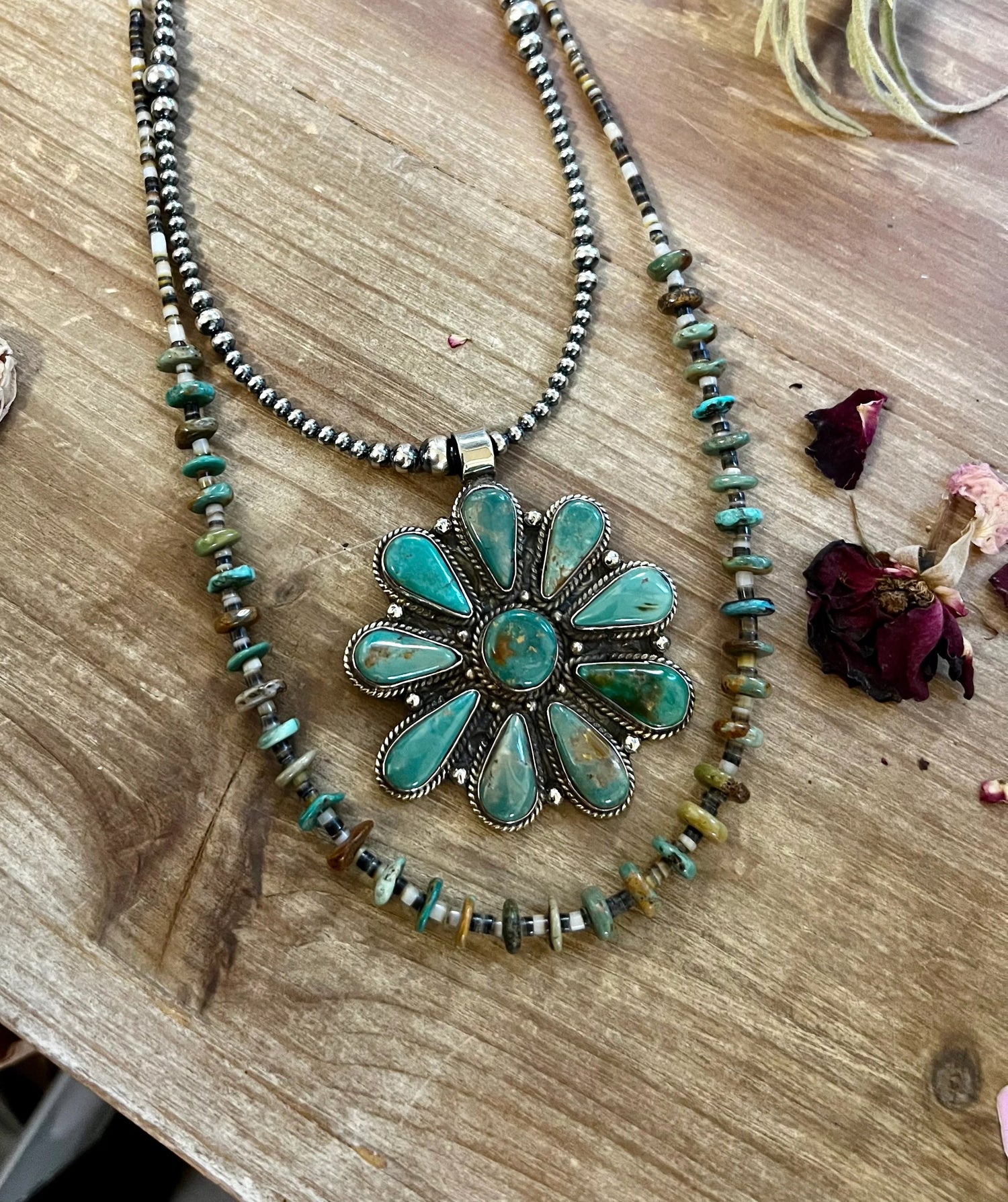 Western-style pendant featuring turquoise and sterling silver. Curated by The Bijoux FAB to complement your jewelry collection.