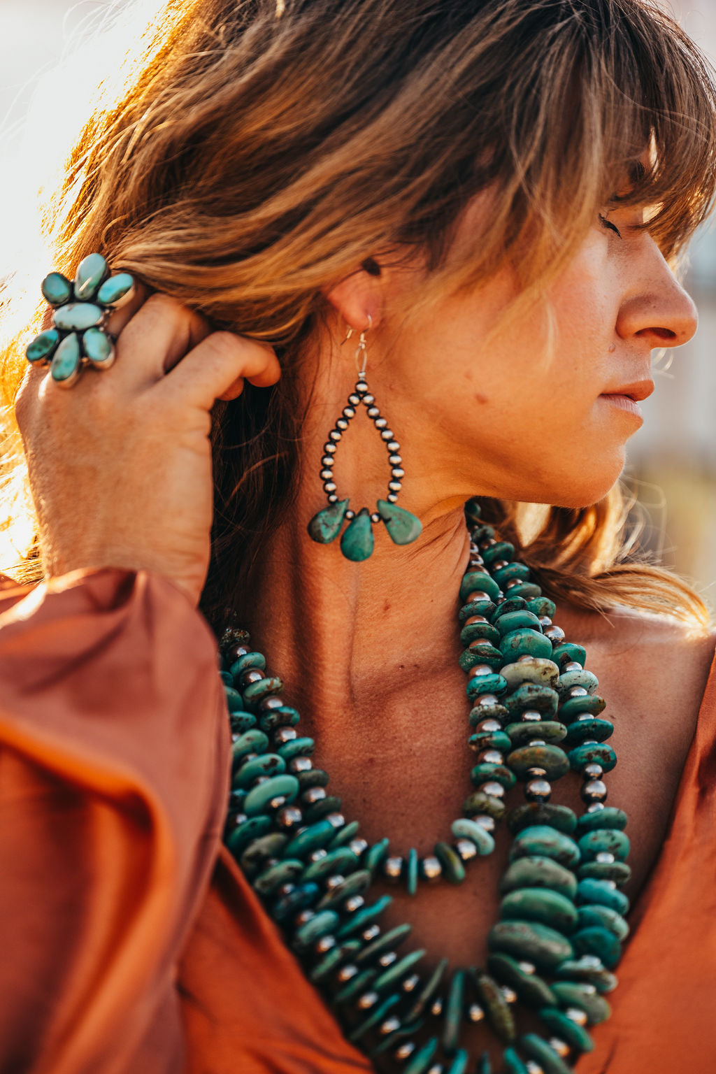 Handmade Western earrings featuring sterling silver pearls and turquoise. Crafted in the USA with high-quality materials.