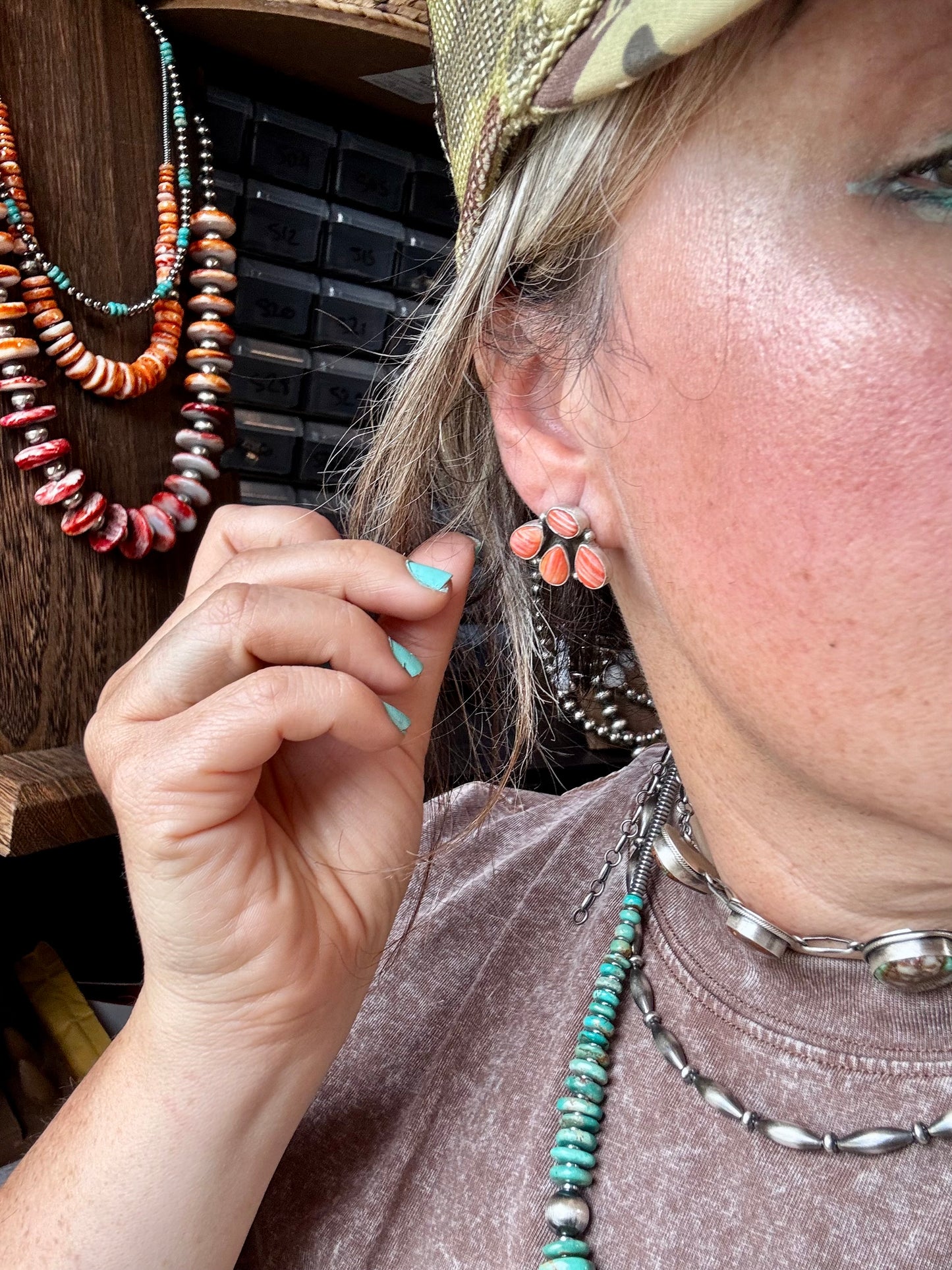 Handcrafted sterling silver stud earrings featuring vibrant spiny oyster shell, stamped by artist Marcella James. Made in the USA. One-of-a-kind design. Curated by The Bijoux FAB.