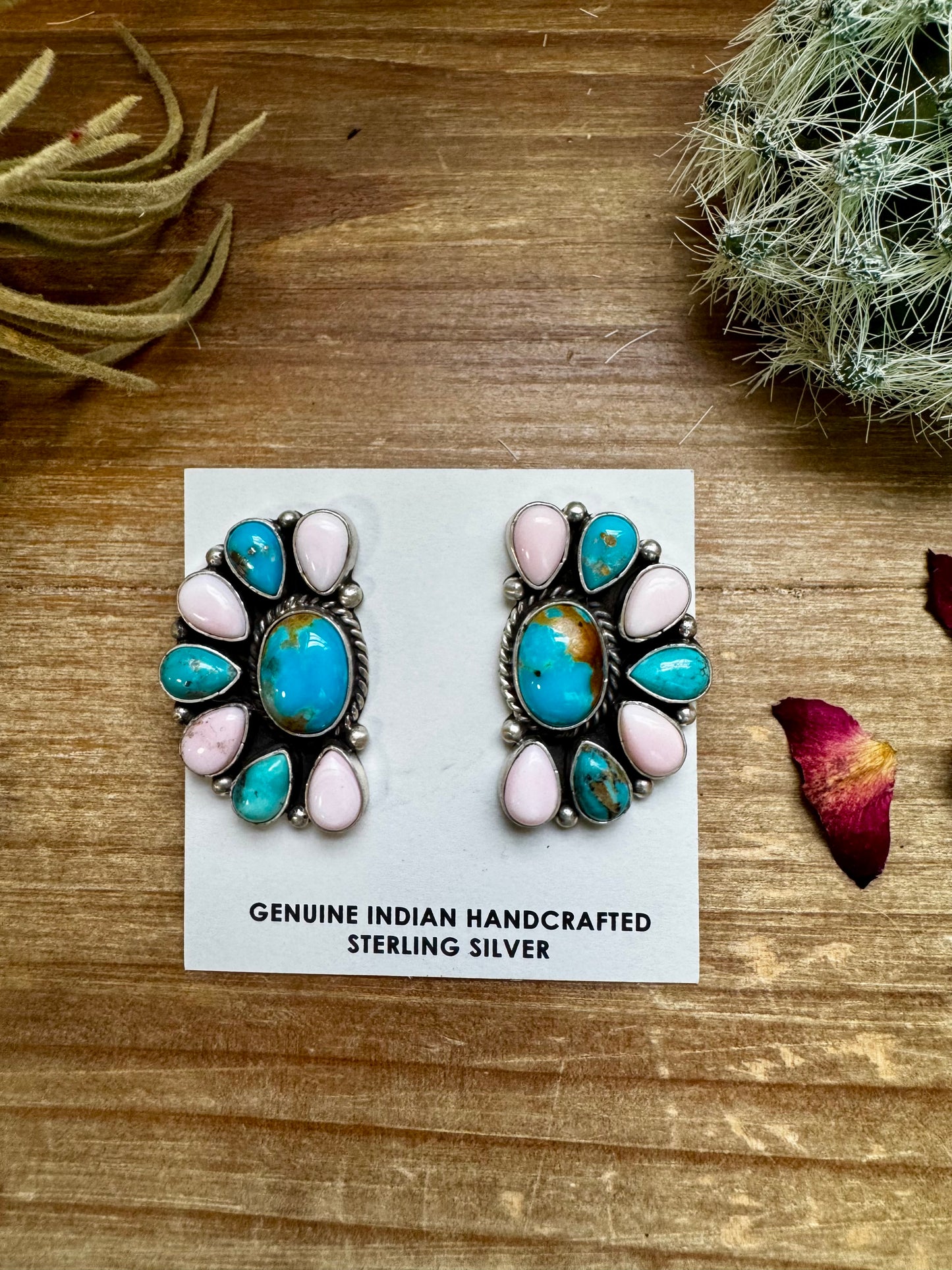 Handcrafted sterling silver half cluster earrings featuring a mix of pink conch and Kingman turquoise in a bold “Cotton Candy” color combo. Stamped E. Richards with post backs placed at the top. Made in the USA. Each pair is unique. Curated by The Bijoux FAB.