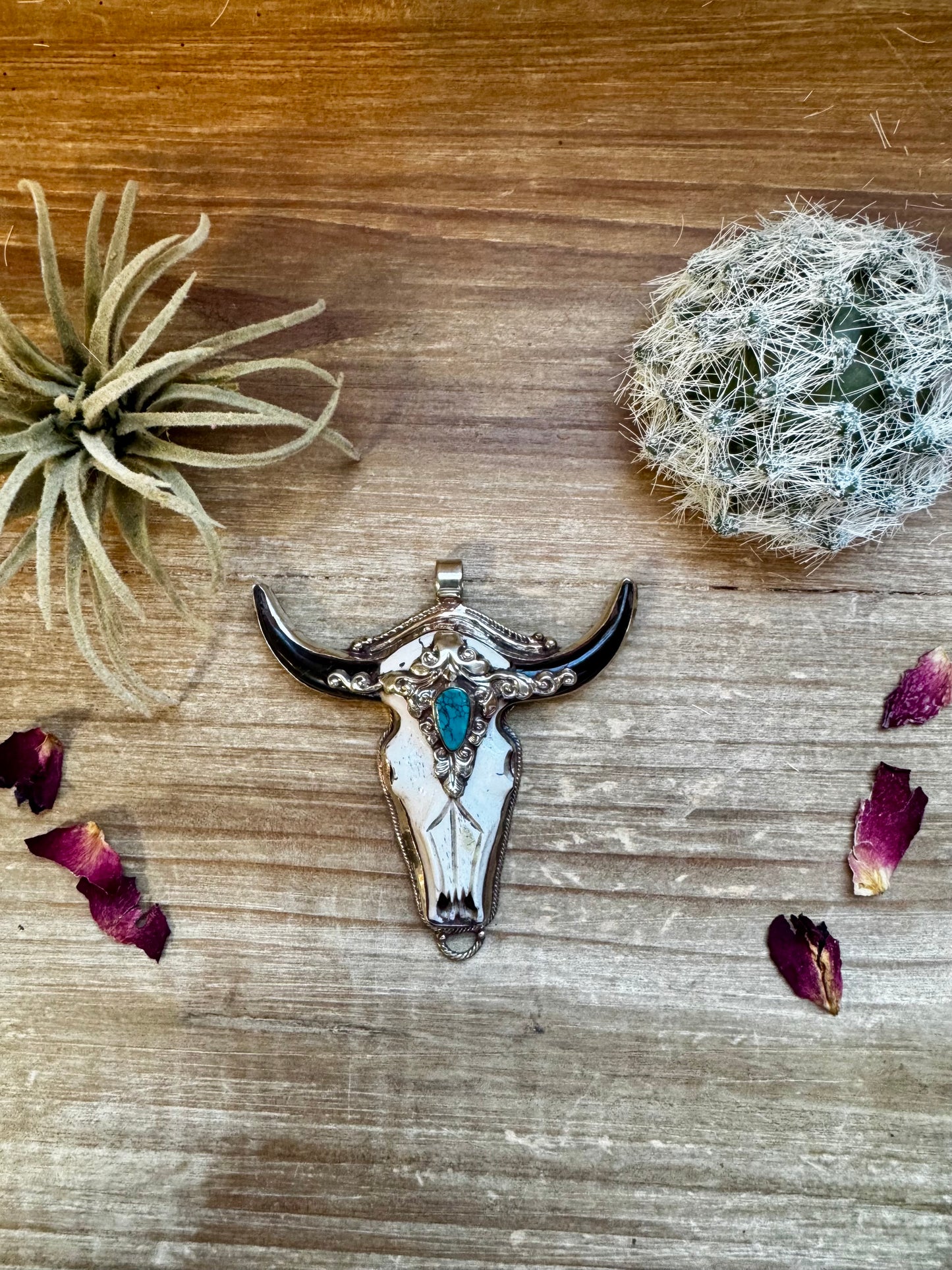 Big Antler longhorn with turquoise pendant