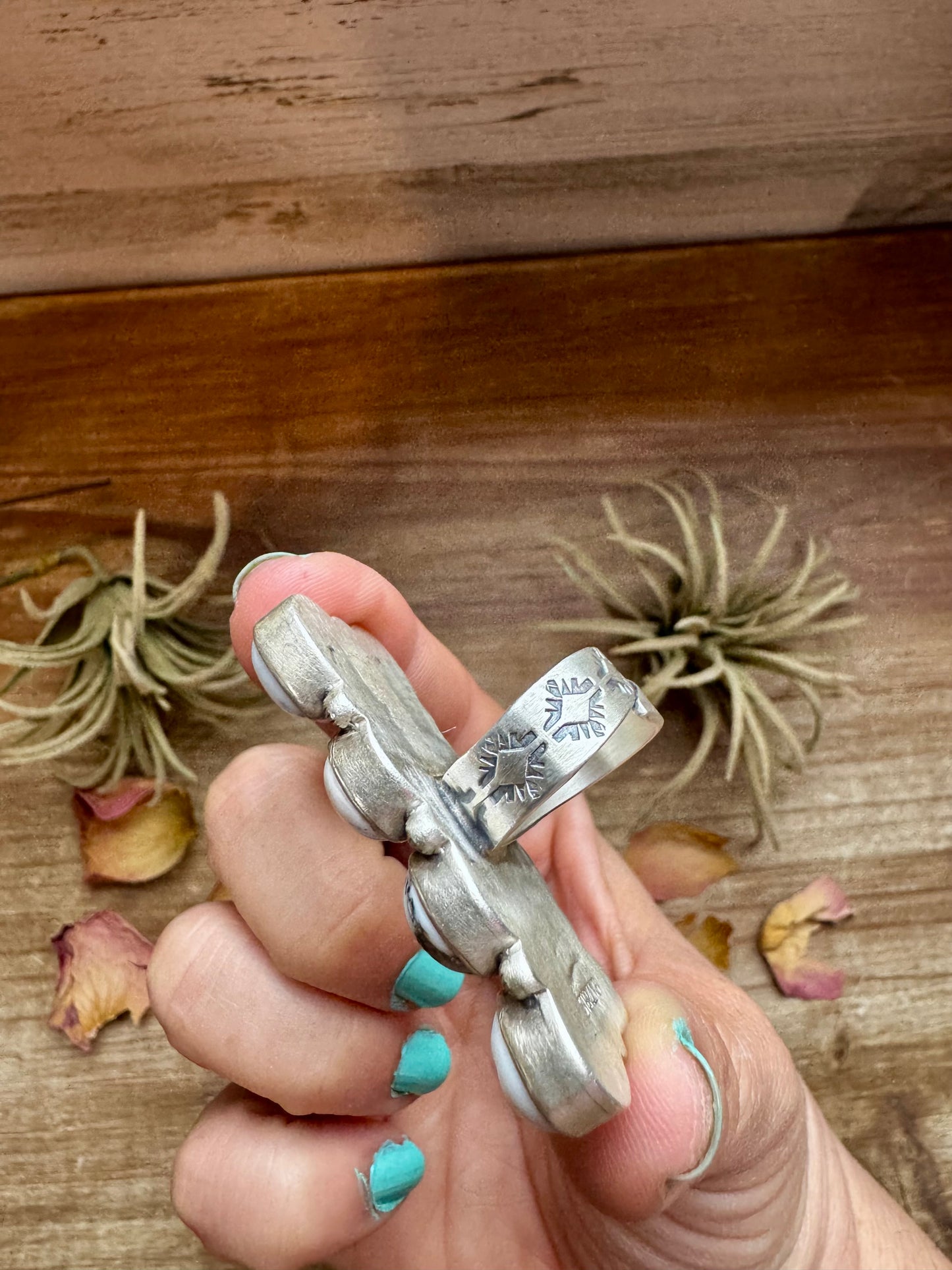 Adjustable long statement ring featuring eight genuine White Buffalo turquoise stones set in solid sterling silver with a detailed band. Stamped ZIA. Handmade in the USA. One-of-a-kind and curated by The Bijoux FAB.