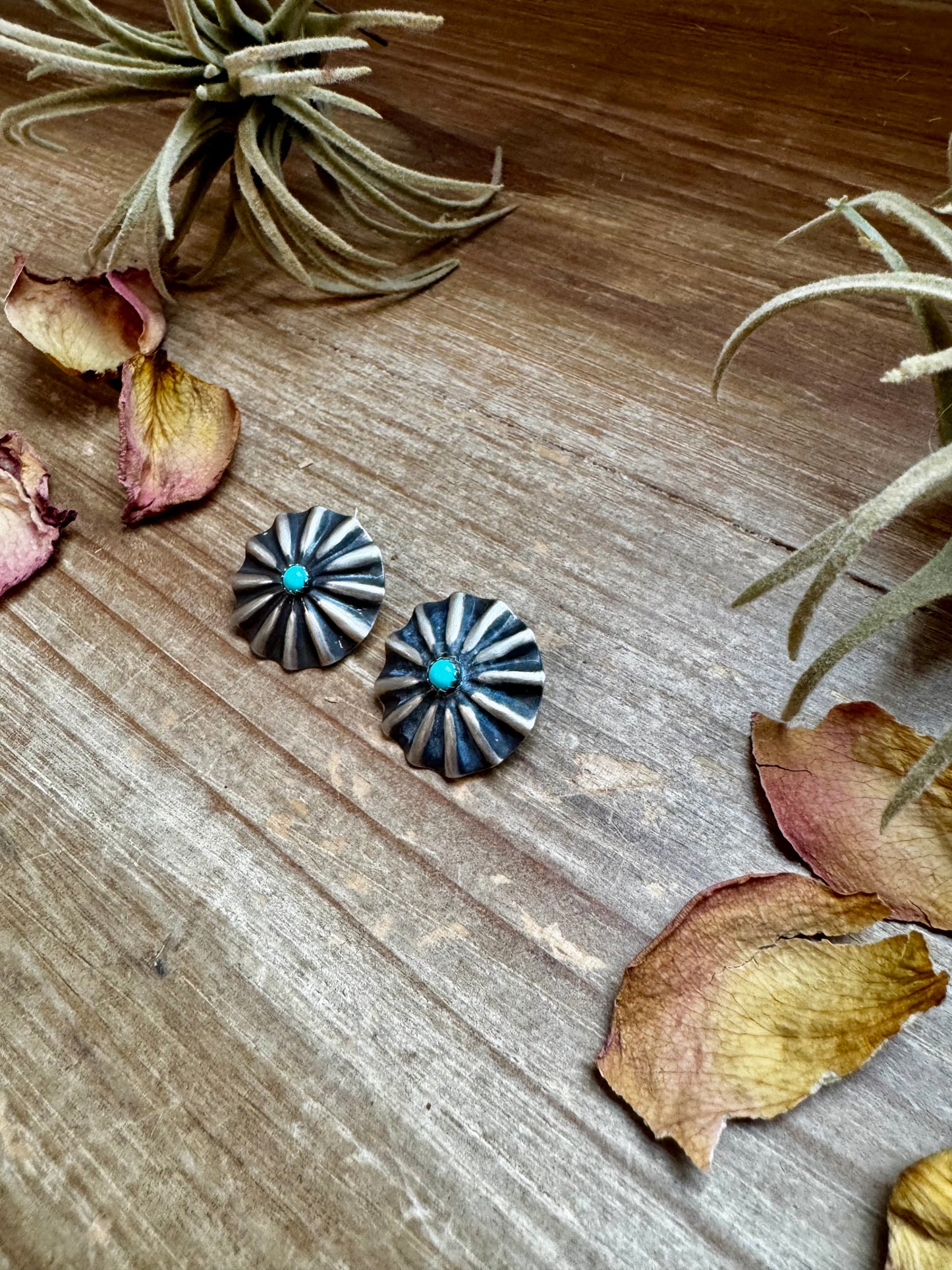 Handcrafted sterling silver concho earrings featuring genuine Kingman turquoise and traditional western stamping. Made in the USA. Each pair is one-of-a-kind. Curated by The Bijoux FAB.