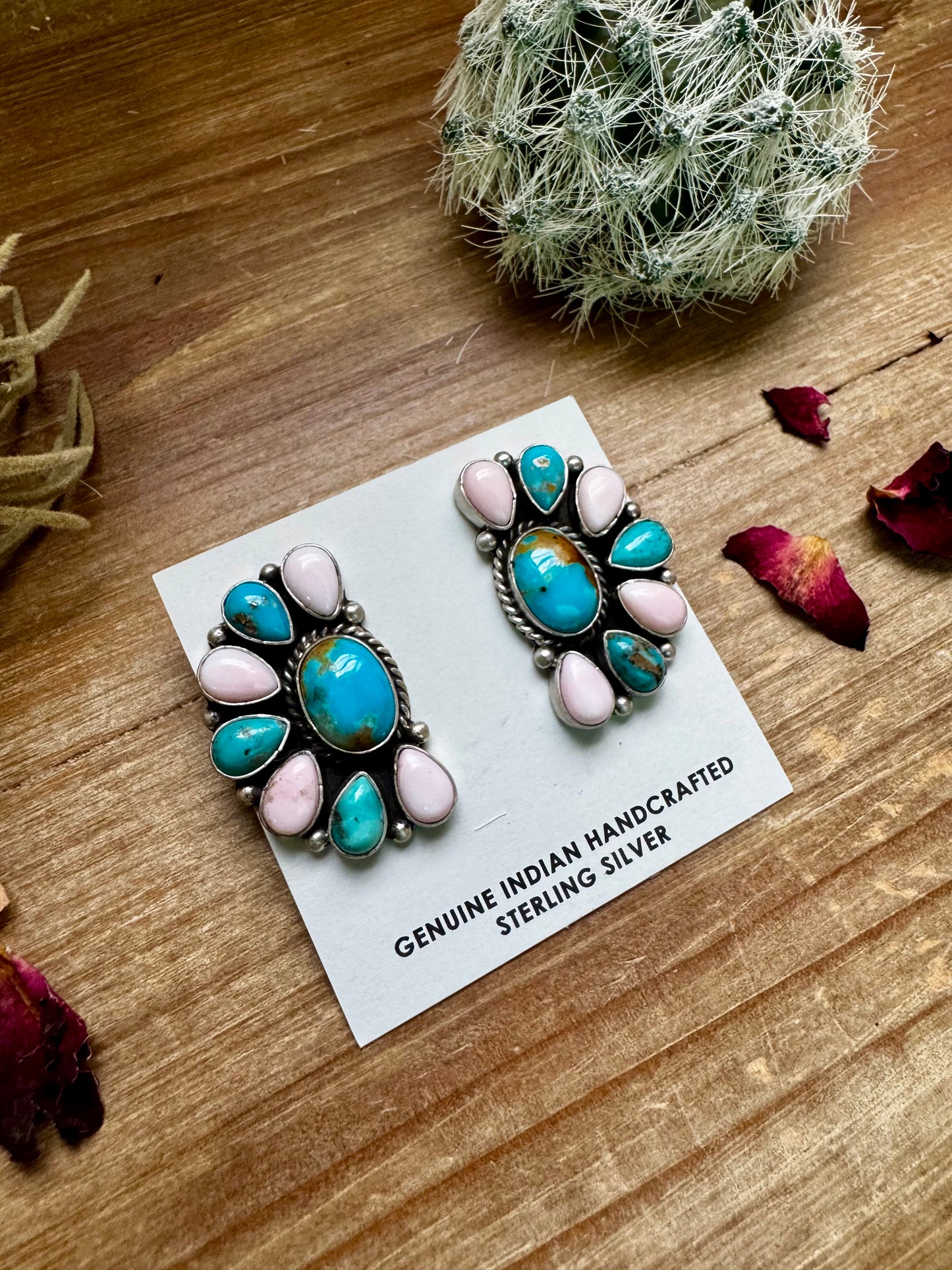 Handcrafted sterling silver half cluster earrings featuring a mix of pink conch and Kingman turquoise in a bold “Cotton Candy” color combo. Stamped E. Richards with post backs placed at the top. Made in the USA. Each pair is unique. Curated by The Bijoux FAB.