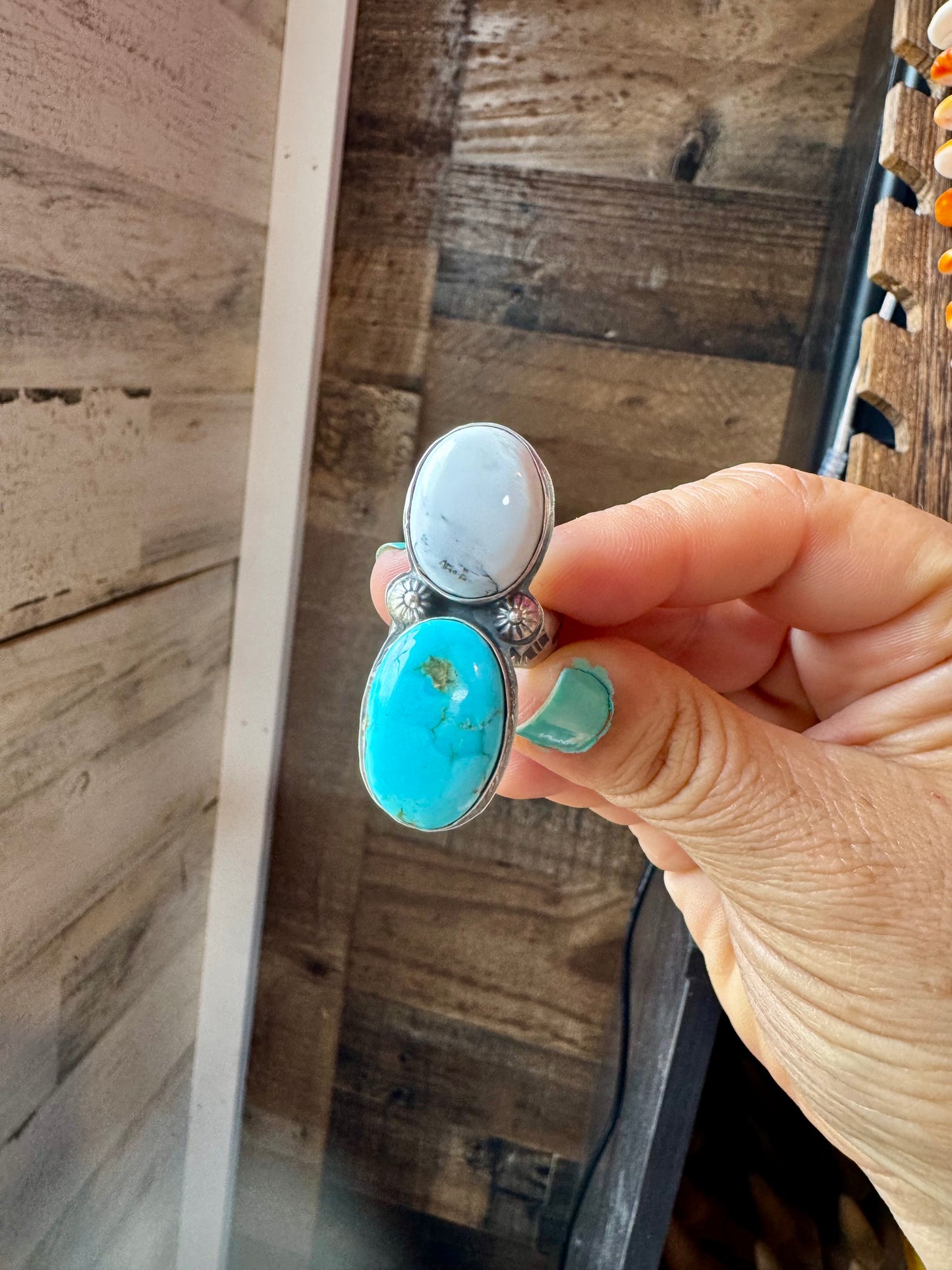 Handcrafted 2-stone ring featuring genuine turquoise and white buffalo set in solid sterling silver. Stamped BJA with an adjustable band. Made in the USA. Each piece is naturally unique. Curated by The Bijoux FAB.