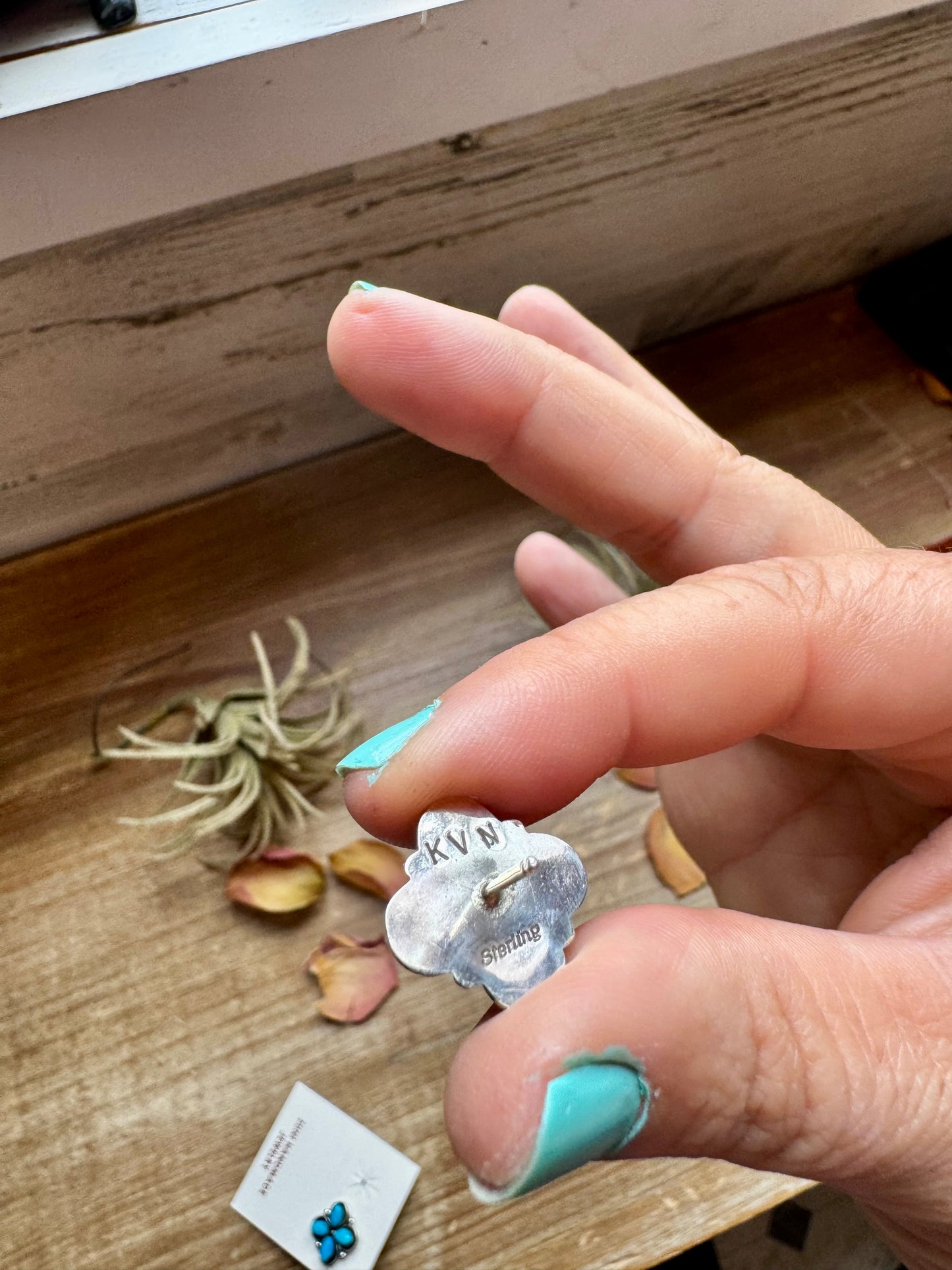 Zuni handmade stud earrings featuring genuine turquoise stones set in detailed sterling silver. Stamped KVN and handcrafted in the USA. Each pair is slightly unique. Curated by The Bijoux FAB.