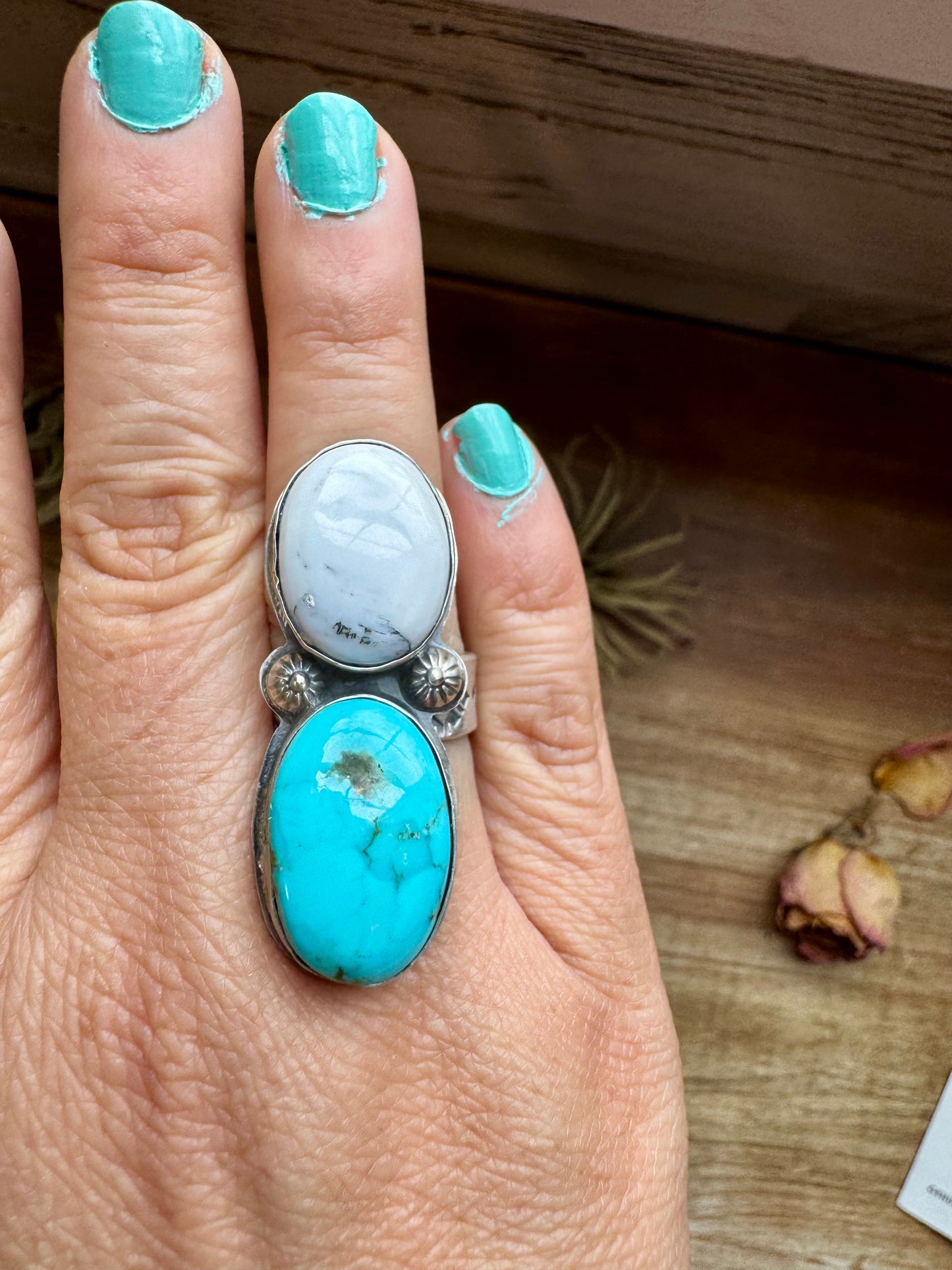 Handcrafted 2-stone ring featuring genuine turquoise and white buffalo set in solid sterling silver. Stamped BJA with an adjustable band. Made in the USA. Each piece is naturally unique. Curated by The Bijoux FAB.
