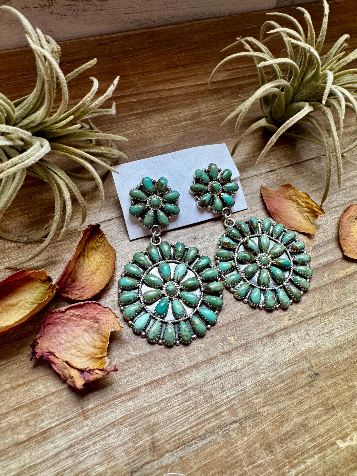 Handcrafted cluster dangle earrings featuring genuine Kingman turquoise stones set in sterling silver with a secure post back. Stamped OM. Made in the USA. Each pair is naturally unique. Curated by The Bijoux FAB.