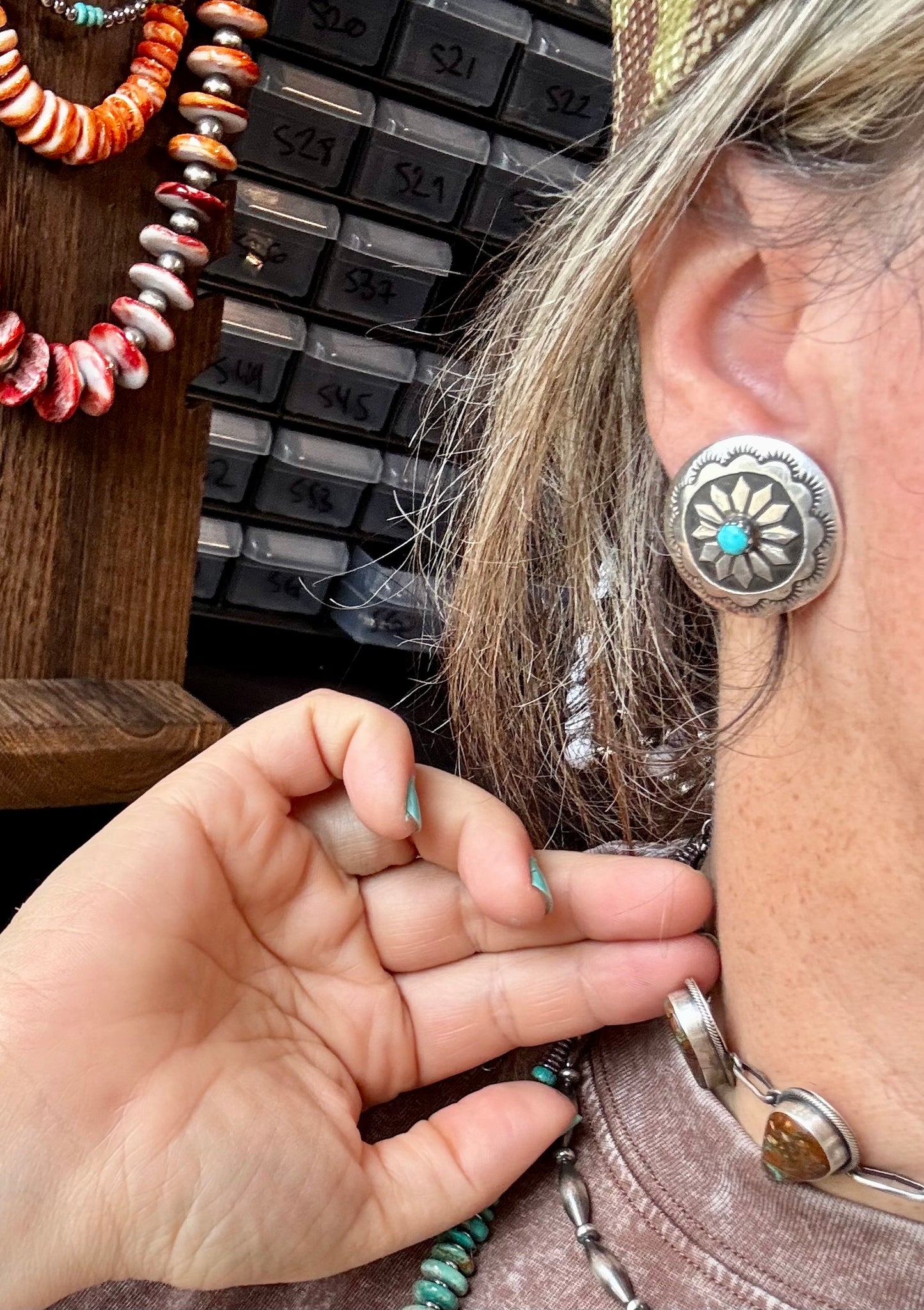 Handcrafted sterling silver concho earrings featuring genuine Kingman turquoise and unique hand-stamped details. Stamped STERLING and made in the USA. Each pair is slightly different. Curated by The Bijoux FAB.