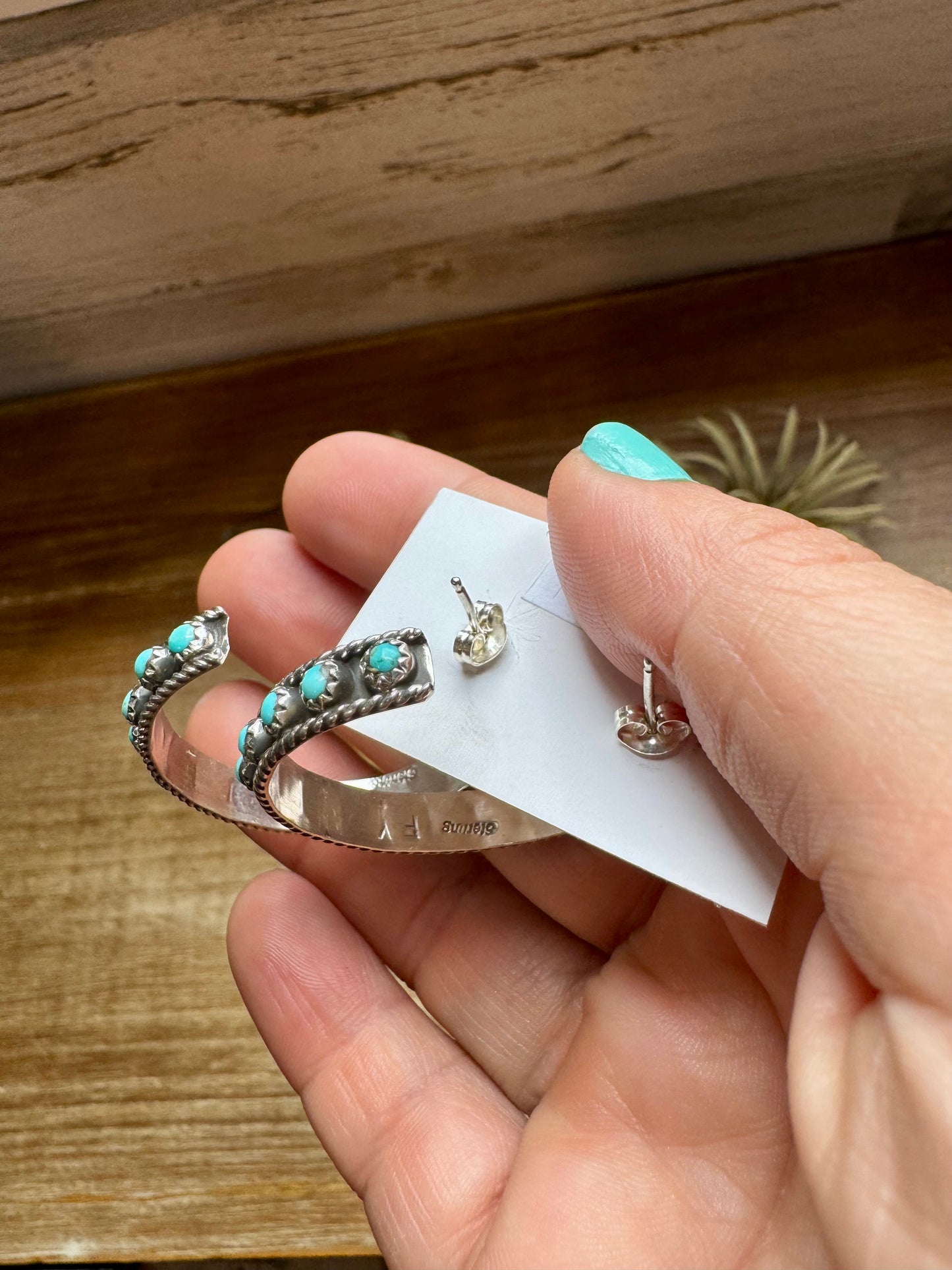 Handcrafted Snake Eye hoop earrings featuring rows of genuine Kingman turquoise stones set in solid sterling silver. Stamped FY and made in the USA. Lightweight and bold. Curated by The Bijoux FAB.