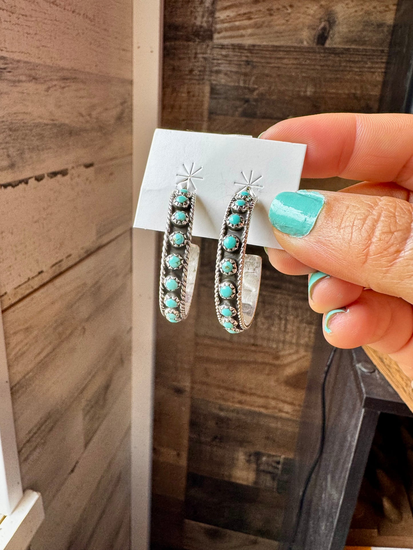 Handcrafted Snake Eye hoop earrings featuring rows of genuine Kingman turquoise stones set in solid sterling silver. Stamped FY and made in the USA. Lightweight and bold. Curated by The Bijoux FAB.