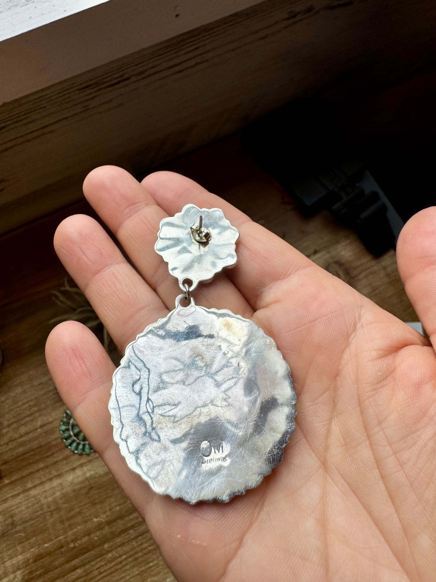 Handcrafted cluster dangle earrings featuring genuine Kingman turquoise stones set in sterling silver with a secure post back. Stamped OM. Made in the USA. Each pair is naturally unique. Curated by The Bijoux FAB.