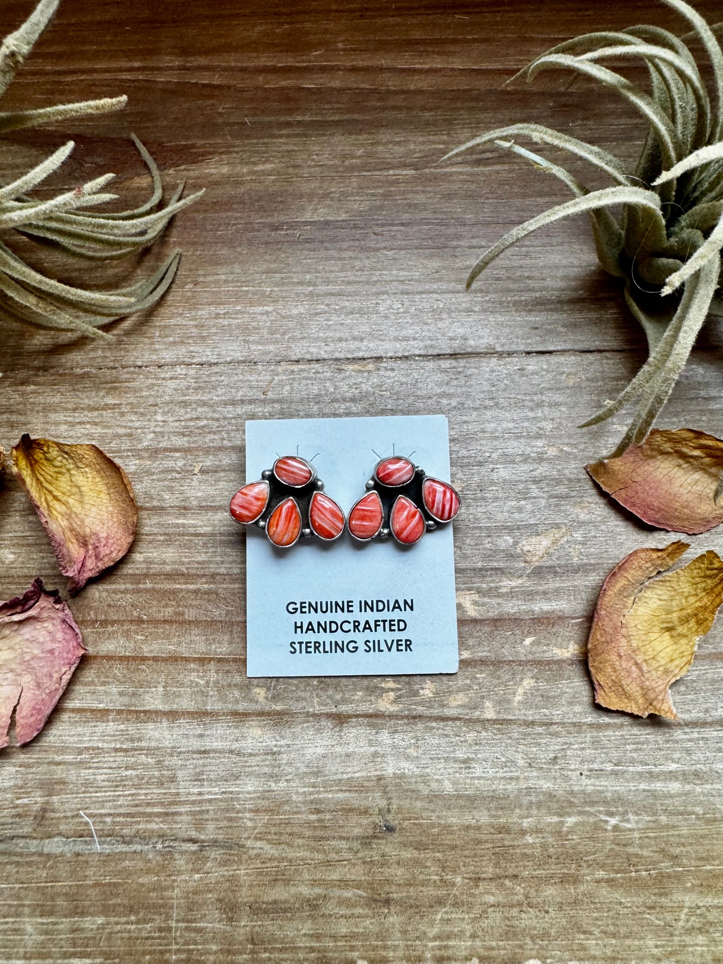 Handcrafted sterling silver stud earrings featuring vibrant spiny oyster shell, stamped by artist Marcella James. Made in the USA. One-of-a-kind design. Curated by The Bijoux FAB.