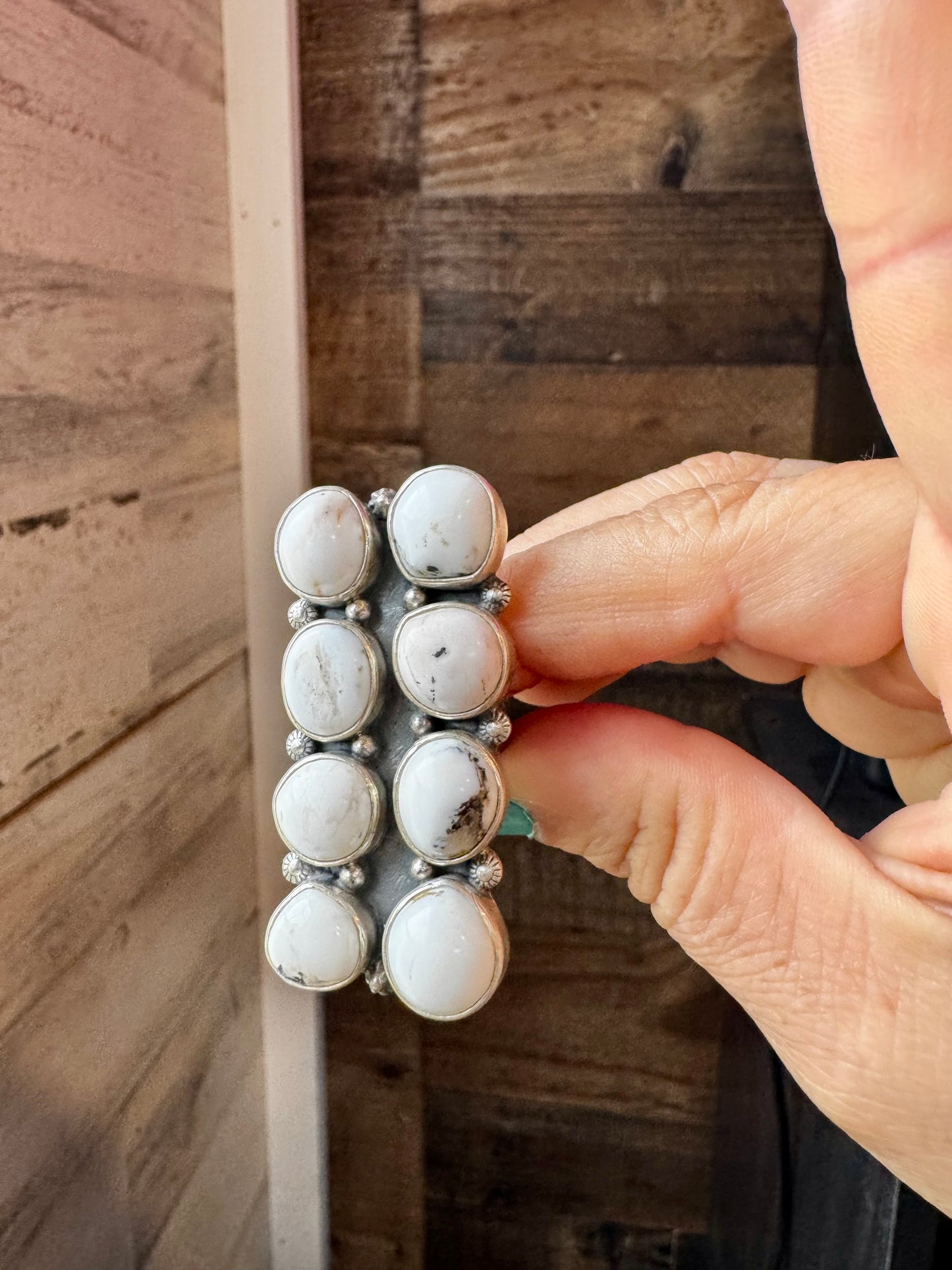 Adjustable long statement ring featuring eight genuine White Buffalo turquoise stones set in solid sterling silver with a detailed band. Stamped ZIA. Handmade in the USA. One-of-a-kind and curated by The Bijoux FAB.