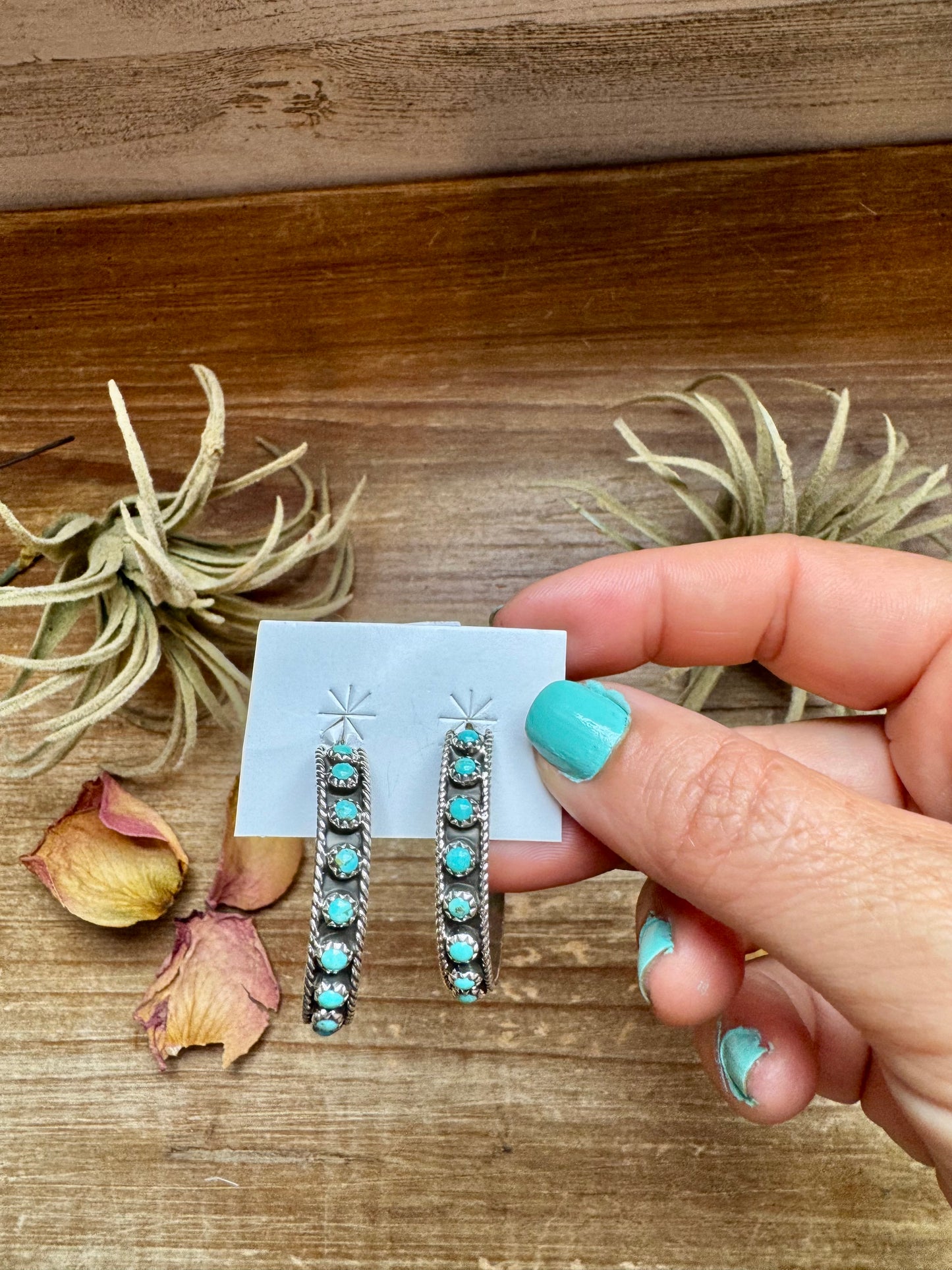 Handcrafted Snake Eye hoop earrings featuring rows of genuine Kingman turquoise stones set in solid sterling silver. Stamped FY and made in the USA. Lightweight and bold. Curated by The Bijoux FAB.
