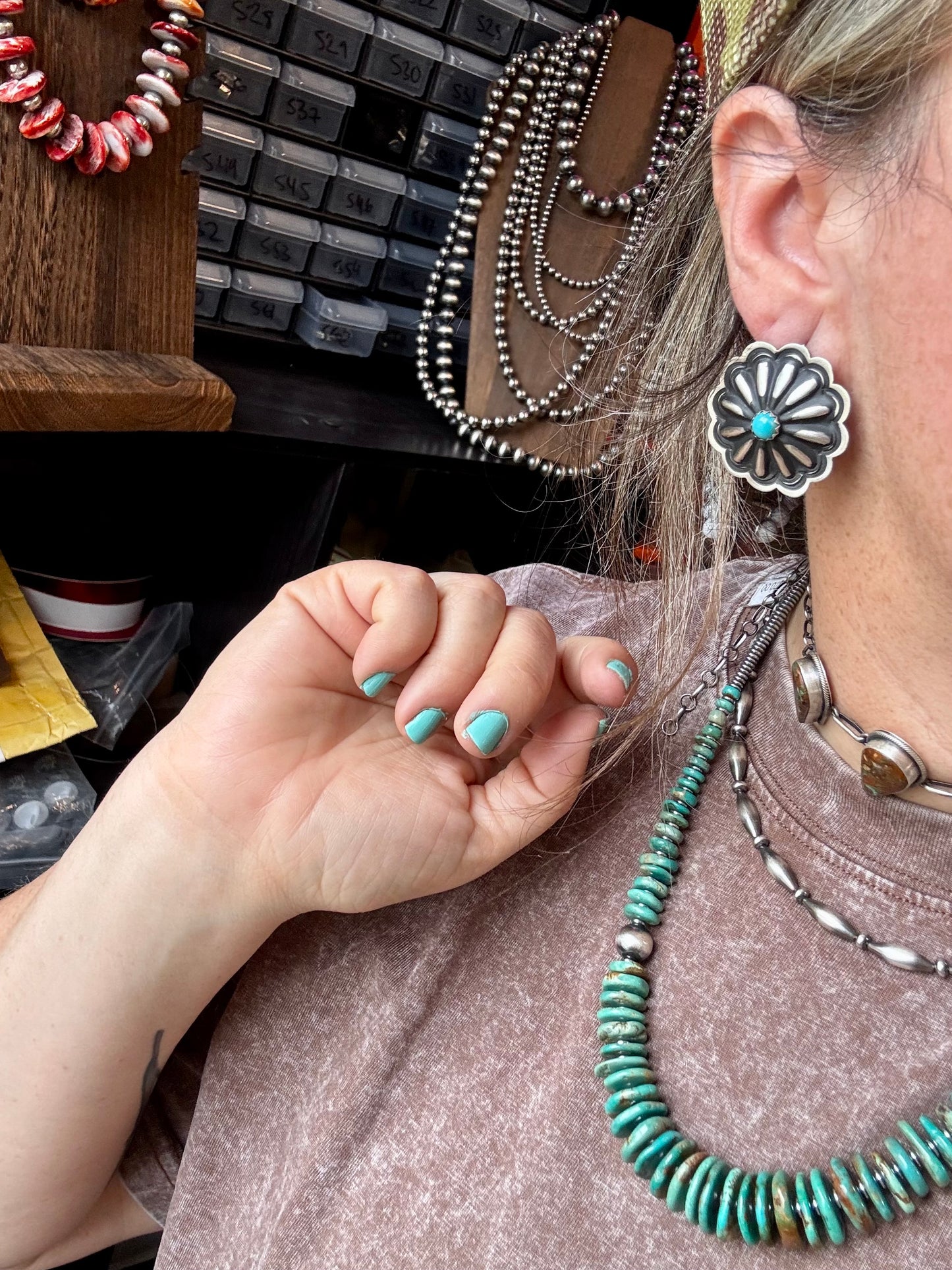Large handcrafted concho stud earrings featuring genuine turquoise stones set in detailed sterling silver. Made in the USA. Lightweight and naturally unique. Curated by The Bijoux FAB.