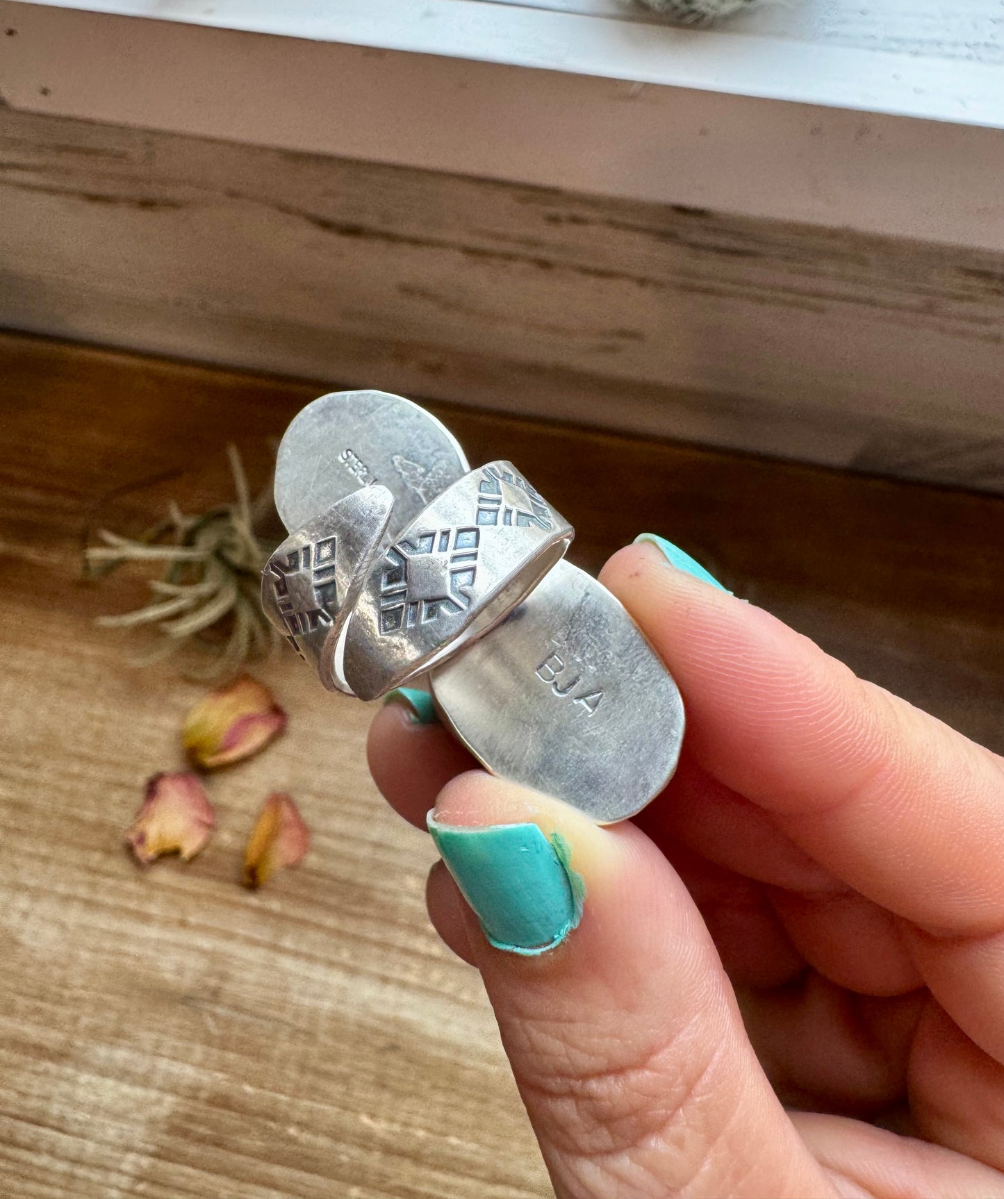 Handcrafted 2-stone ring featuring genuine turquoise and white buffalo set in solid sterling silver. Stamped BJA with an adjustable band. Made in the USA. Each piece is naturally unique. Curated by The Bijoux FAB.