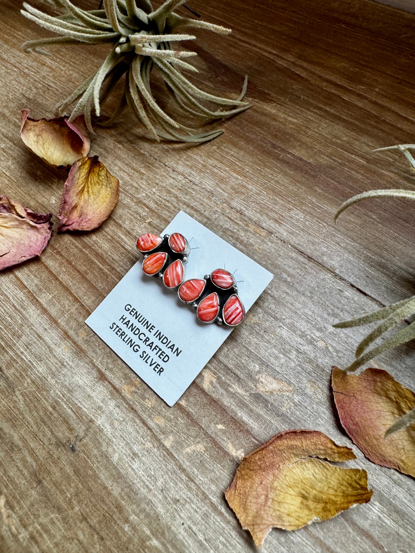 Handcrafted sterling silver stud earrings featuring vibrant spiny oyster shell, stamped by artist Marcella James. Made in the USA. One-of-a-kind design. Curated by The Bijoux FAB.