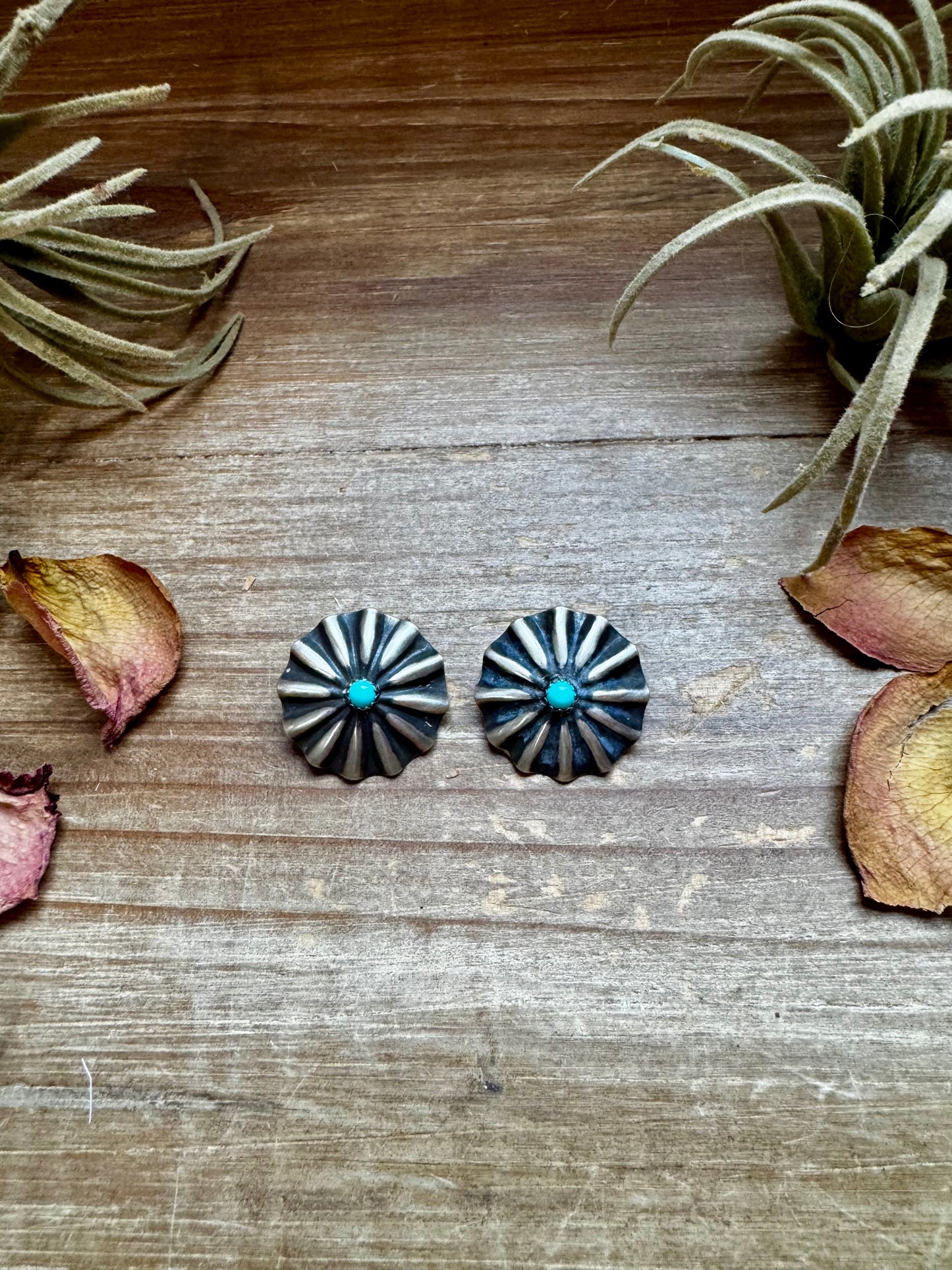 Handcrafted sterling silver concho earrings featuring genuine Kingman turquoise and traditional western stamping. Made in the USA. Each pair is one-of-a-kind. Curated by The Bijoux FAB.