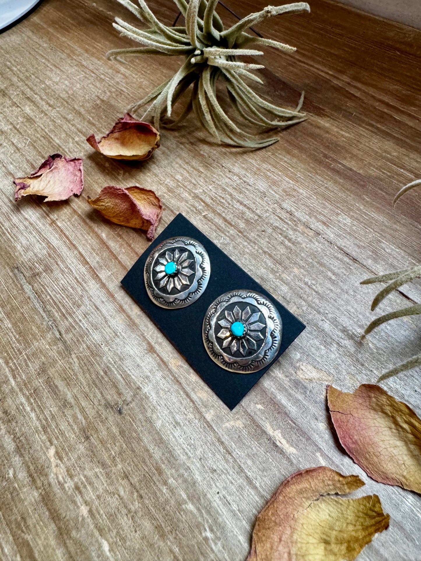 Handcrafted sterling silver concho earrings featuring genuine Kingman turquoise and unique hand-stamped details. Stamped STERLING and made in the USA. Each pair is slightly different. Curated by The Bijoux FAB.