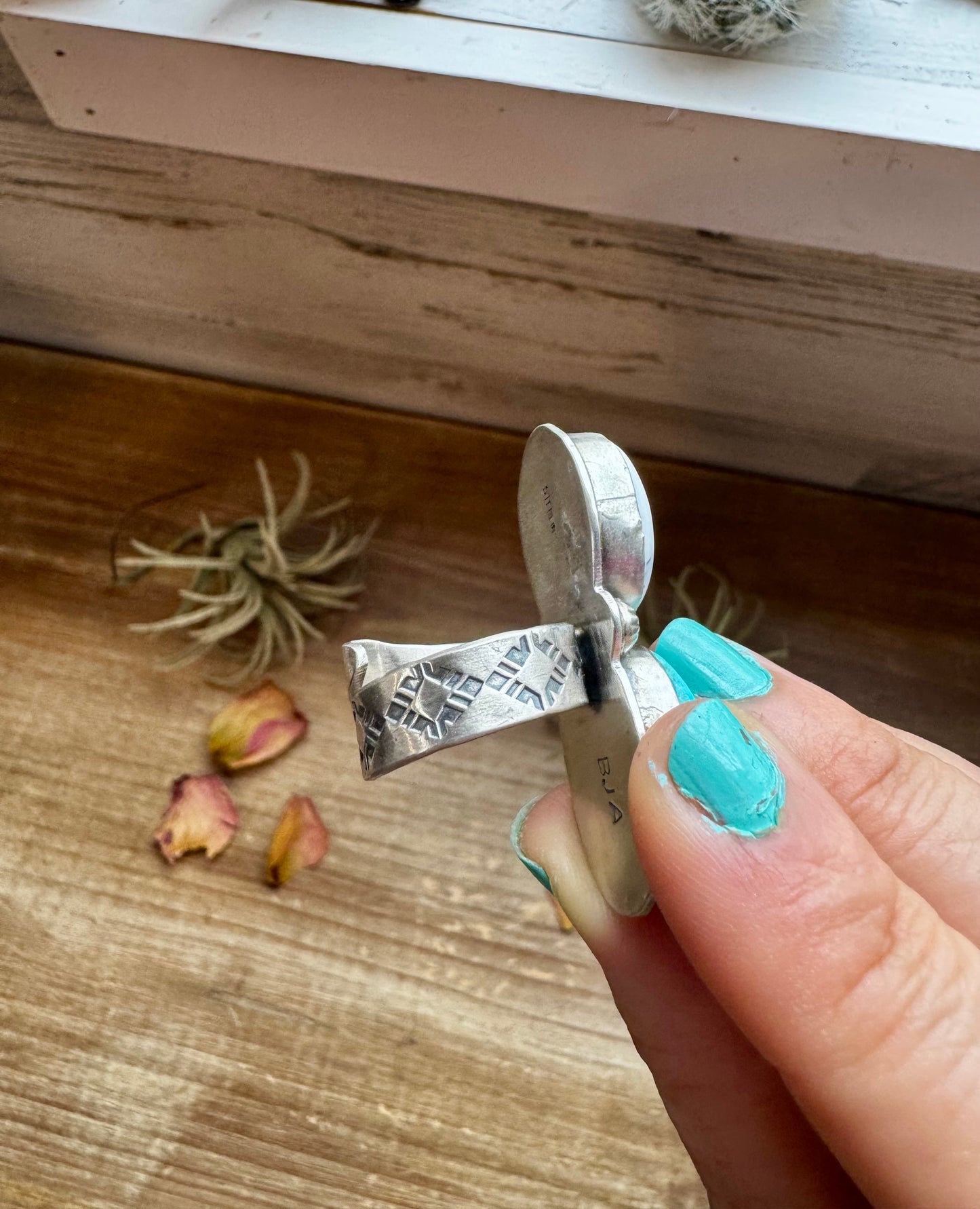 Handcrafted 2-stone ring featuring genuine turquoise and white buffalo set in solid sterling silver. Stamped BJA with an adjustable band. Made in the USA. Each piece is naturally unique. Curated by The Bijoux FAB.