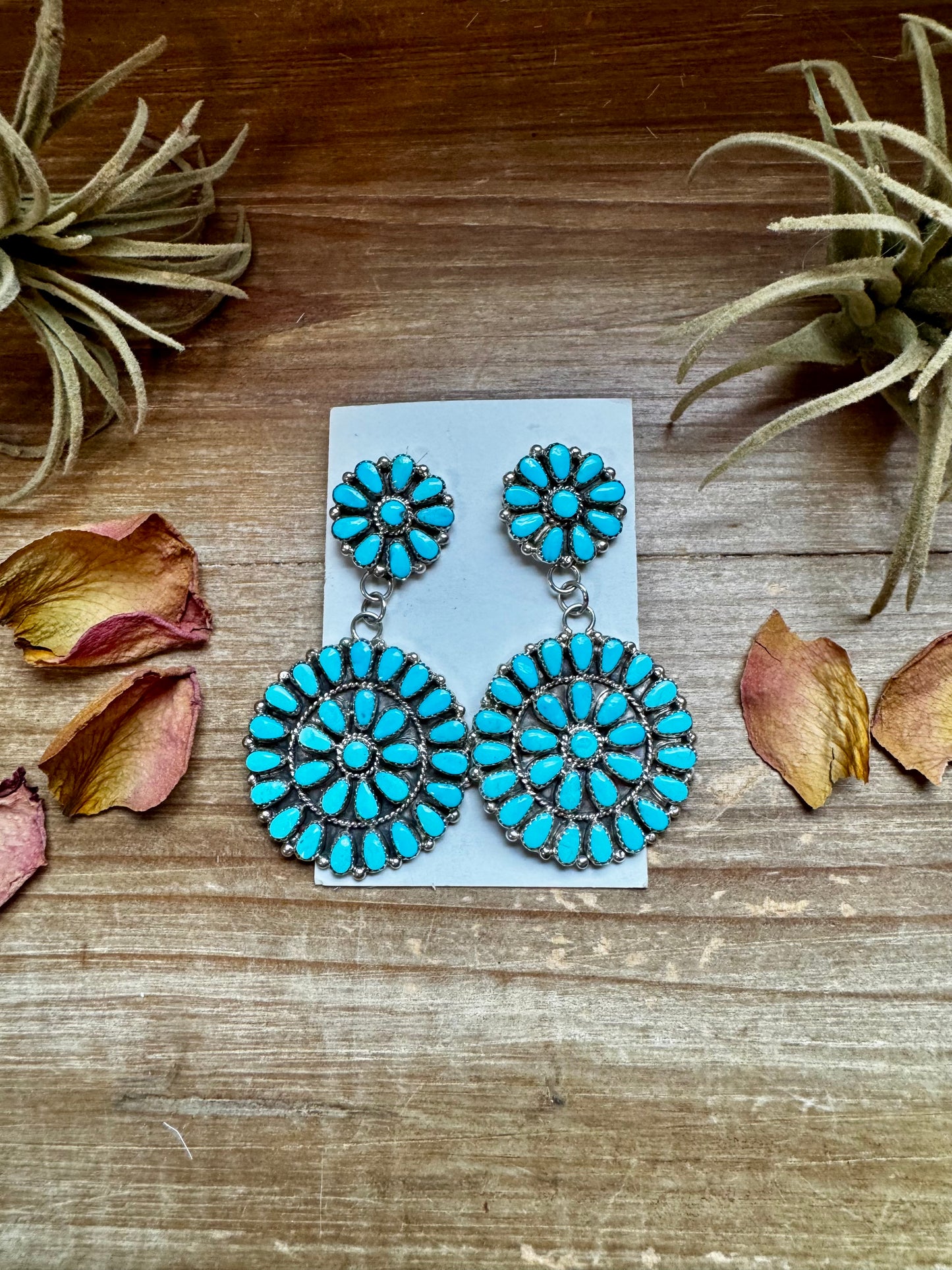 Handcrafted sterling silver cluster dangle earrings featuring genuine Sleeping Beauty turquoise stones. Post backs placed at the top for a secure drape. Artist-stamped and made in the USA. One of a kind. Curated by The Bijoux FAB.