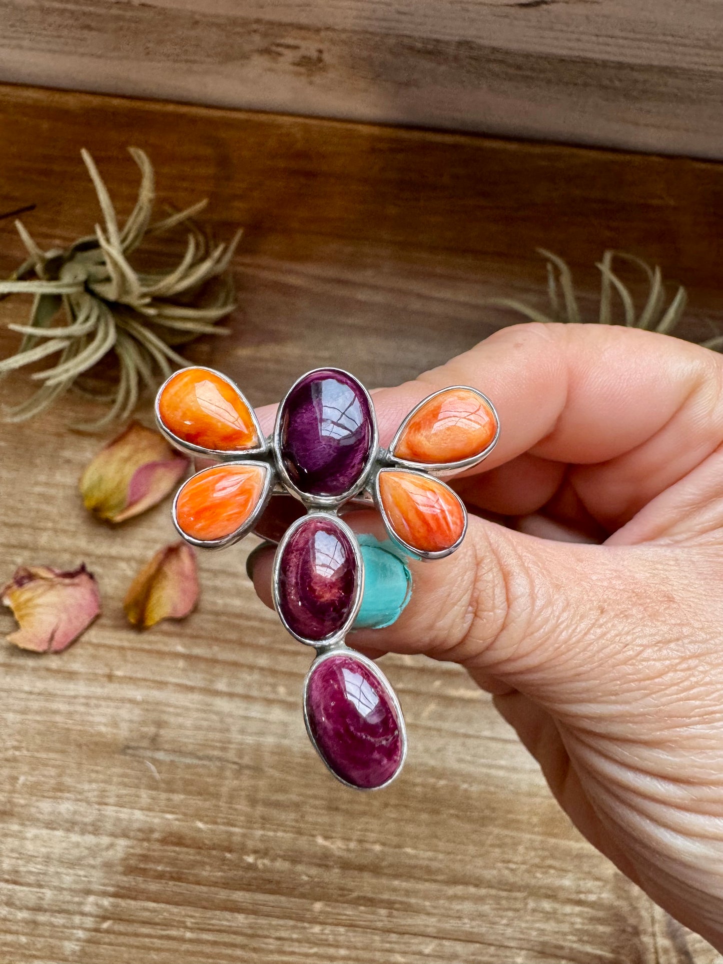 Handcrafted sterling silver dragonfly ring featuring purple and orange spiny oyster stones. Stamped ZIA and made in the USA. Adjustable fit and full of playful personality. Curated by The Bijoux FAB.