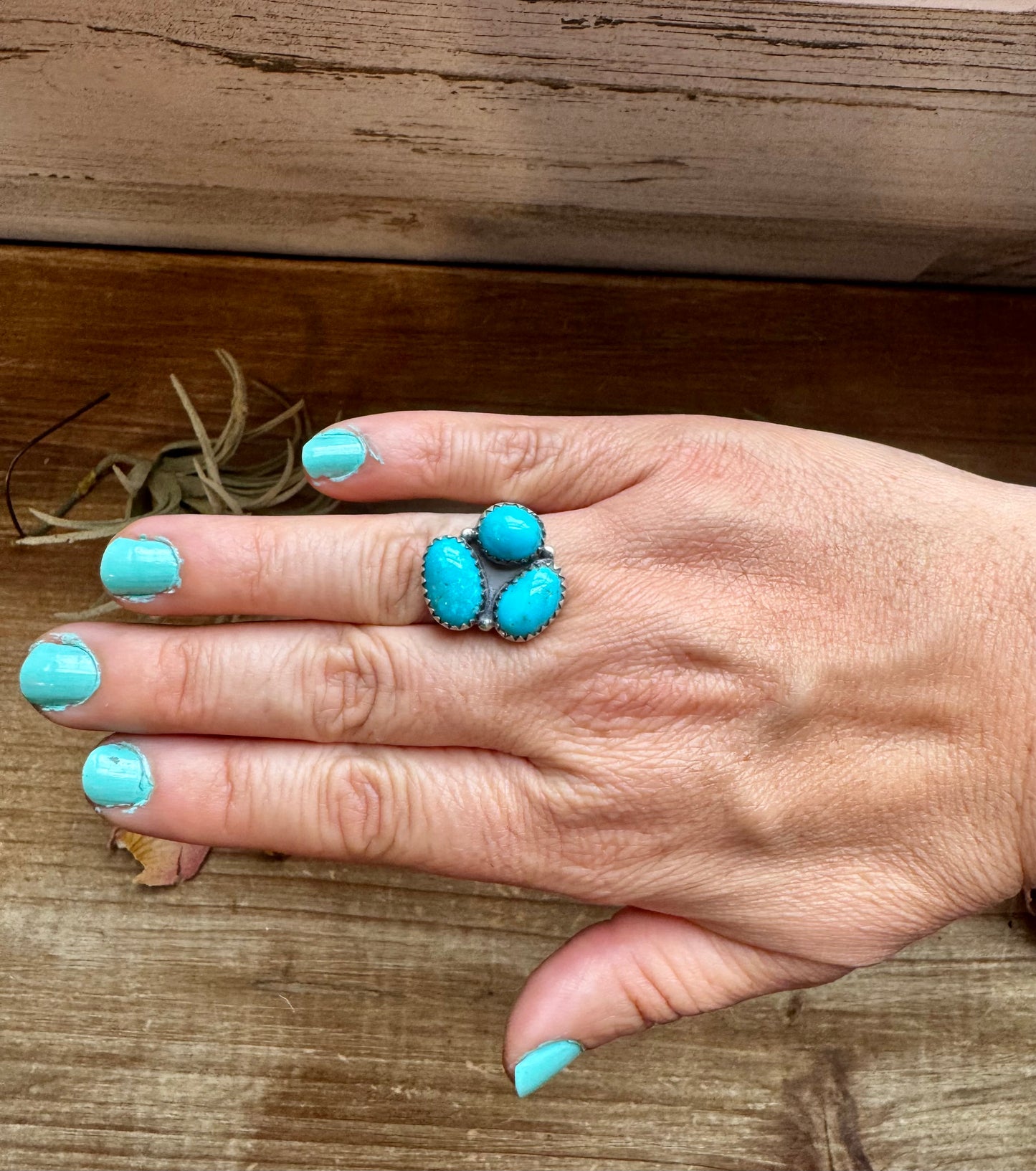 Adjustable sterling silver ring featuring three genuine Kingman turquoise stones in a bold southwestern design. Handmade in the USA. Each ring is naturally unique. Curated by The Bijoux FAB.