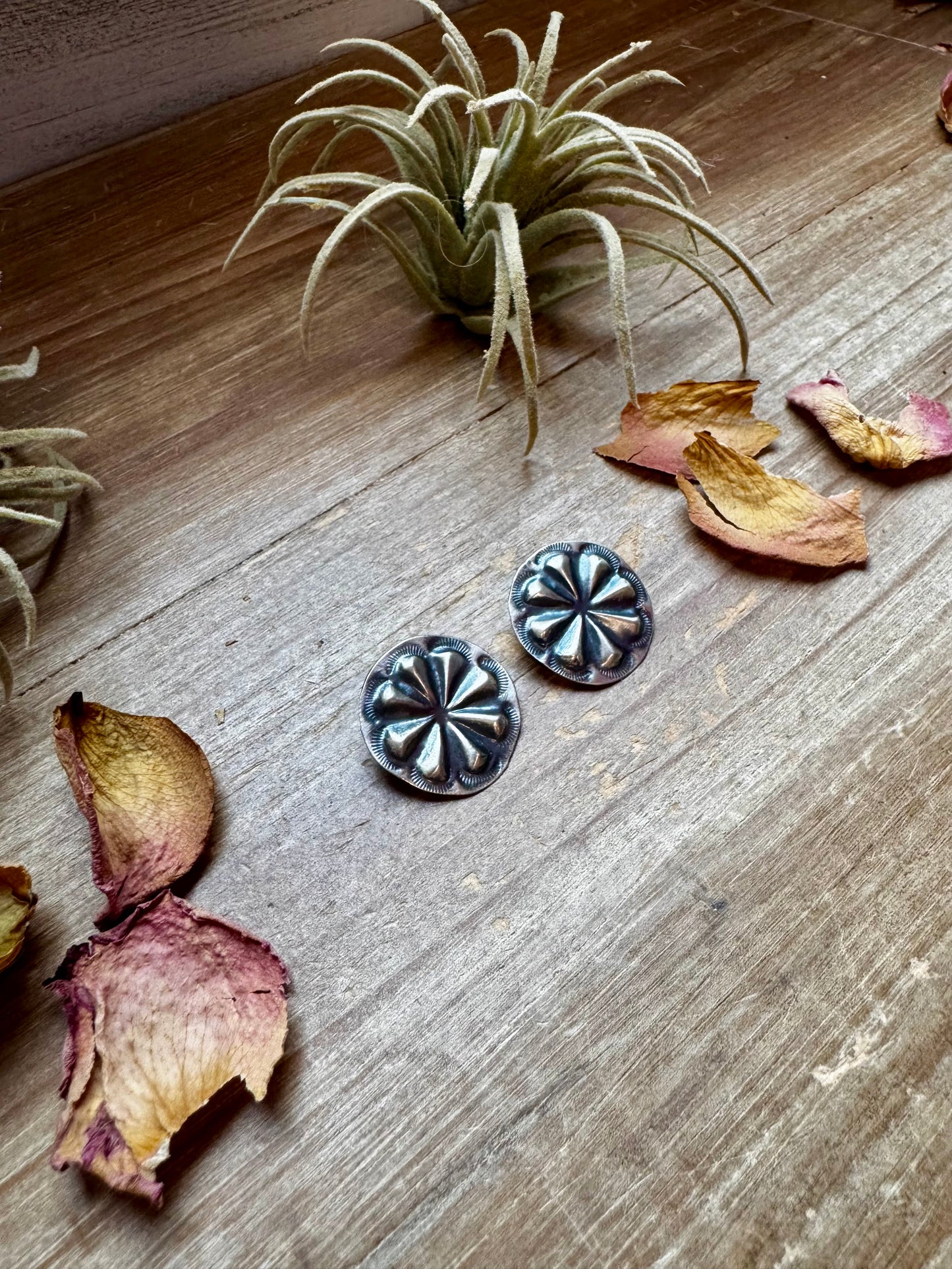 Handcrafted sterling silver concho stud earrings with traditional western stamping and stud backing. Stamped STERLING and made in the USA. Lightweight and easy to wear. Curated by The Bijoux FAB.
