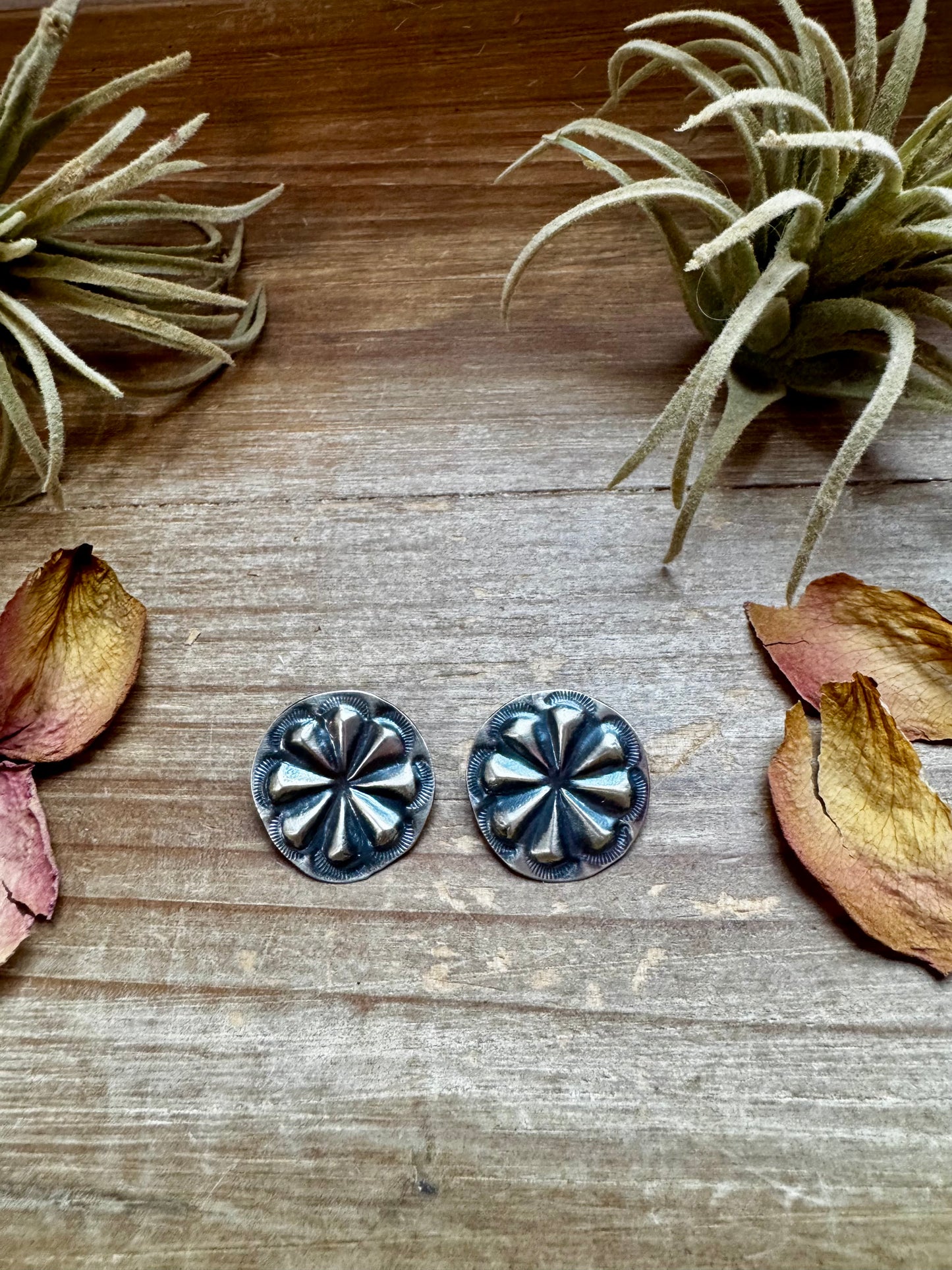 Handcrafted sterling silver concho stud earrings with traditional western stamping and stud backing. Stamped STERLING and made in the USA. Lightweight and easy to wear. Curated by The Bijoux FAB.