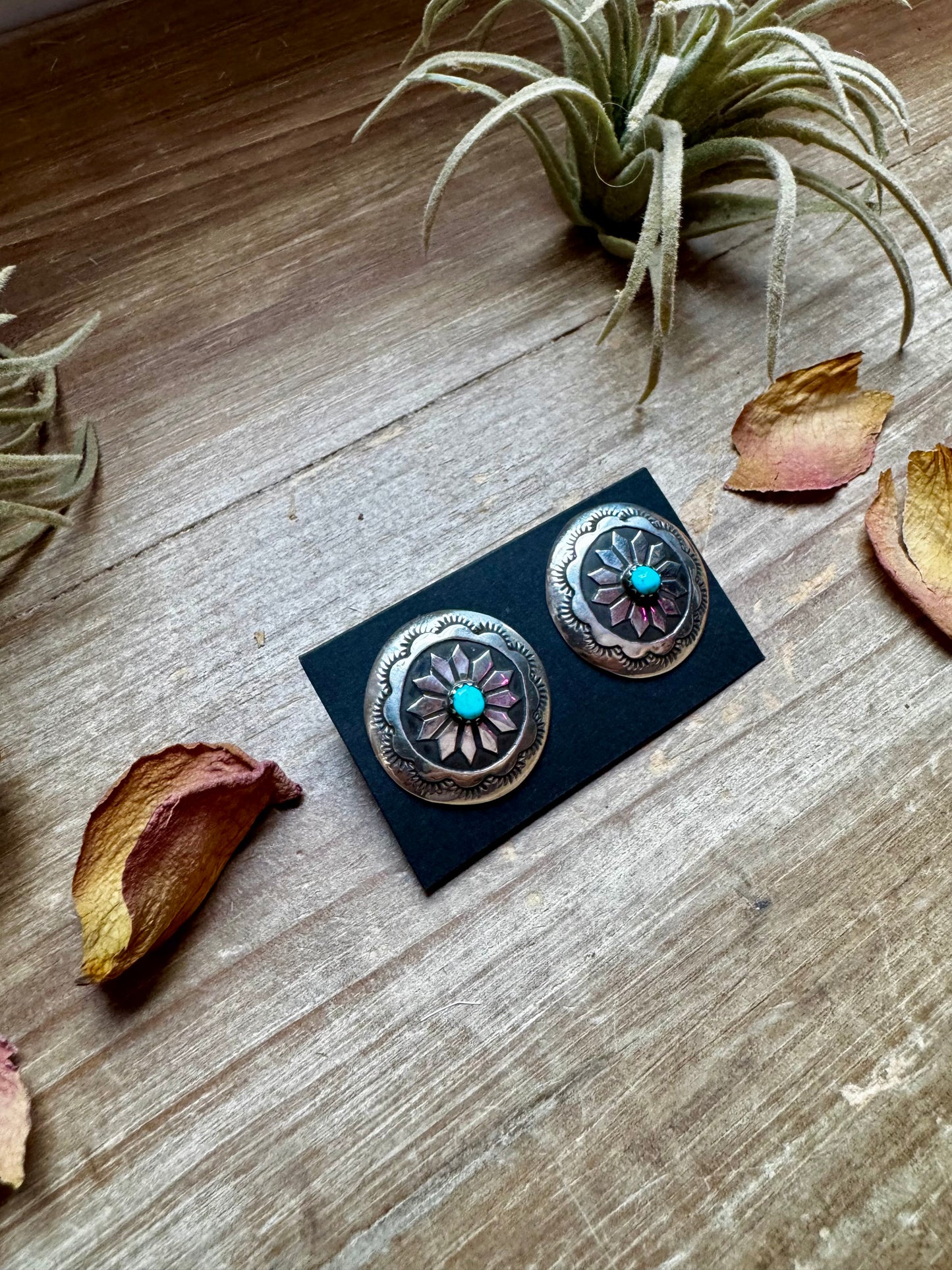 Handcrafted sterling silver concho earrings featuring genuine Kingman turquoise and unique hand-stamped details. Stamped STERLING and made in the USA. Each pair is slightly different. Curated by The Bijoux FAB.