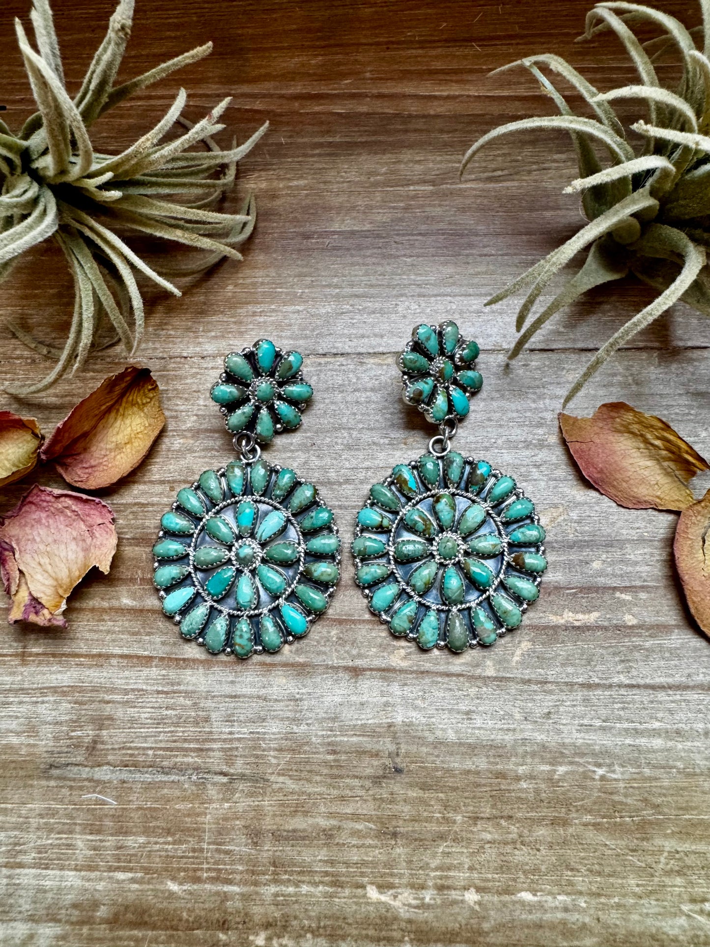 Handcrafted cluster dangle earrings featuring genuine Kingman turquoise stones set in sterling silver with a secure post back. Stamped OM. Made in the USA. Each pair is naturally unique. Curated by The Bijoux FAB.