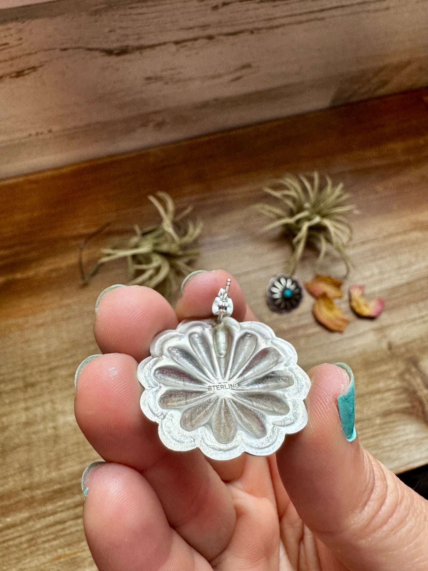 Large handcrafted concho stud earrings featuring genuine turquoise stones set in detailed sterling silver. Made in the USA. Lightweight and naturally unique. Curated by The Bijoux FAB.