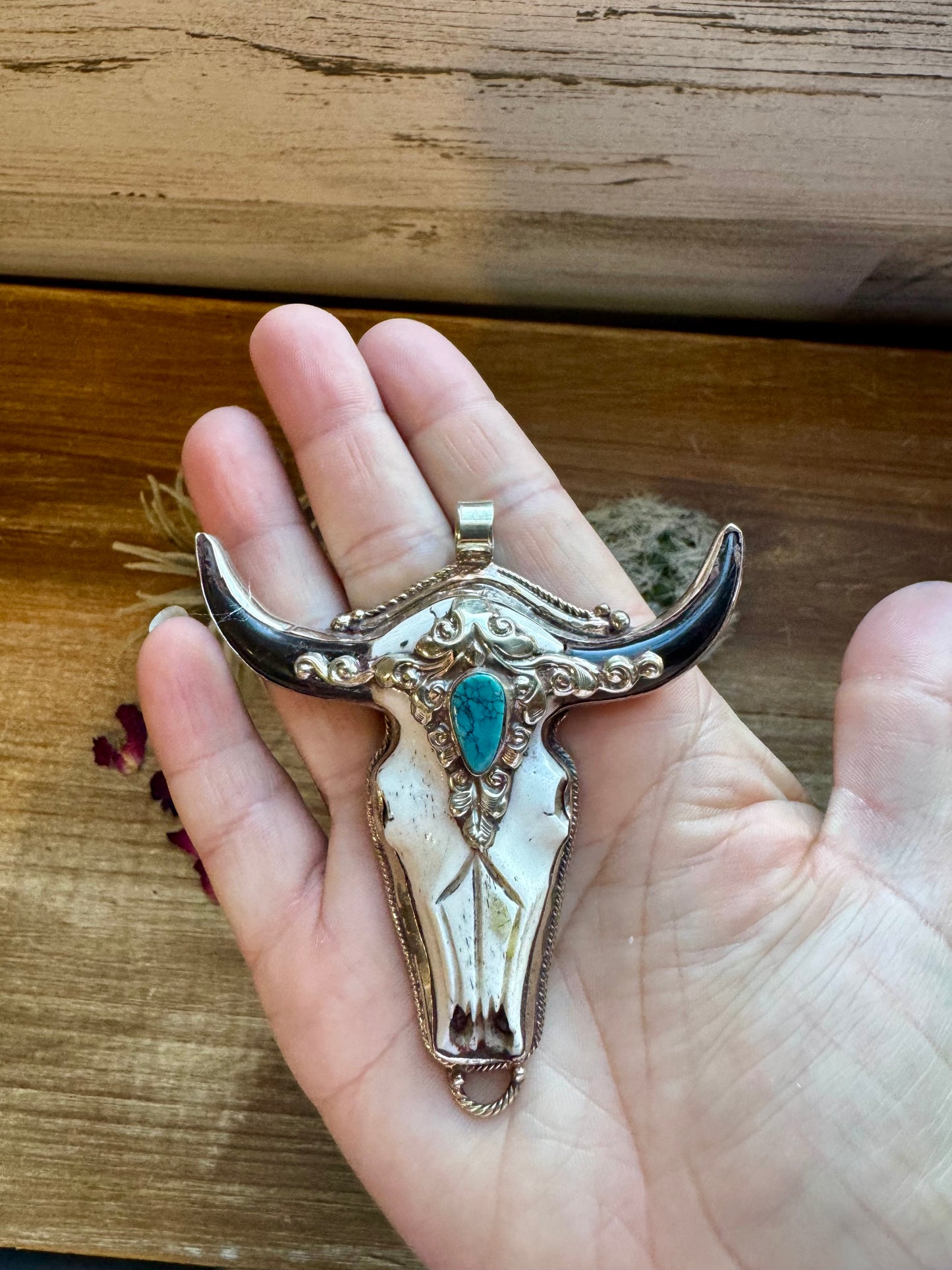 Big Antler longhorn with turquoise pendant