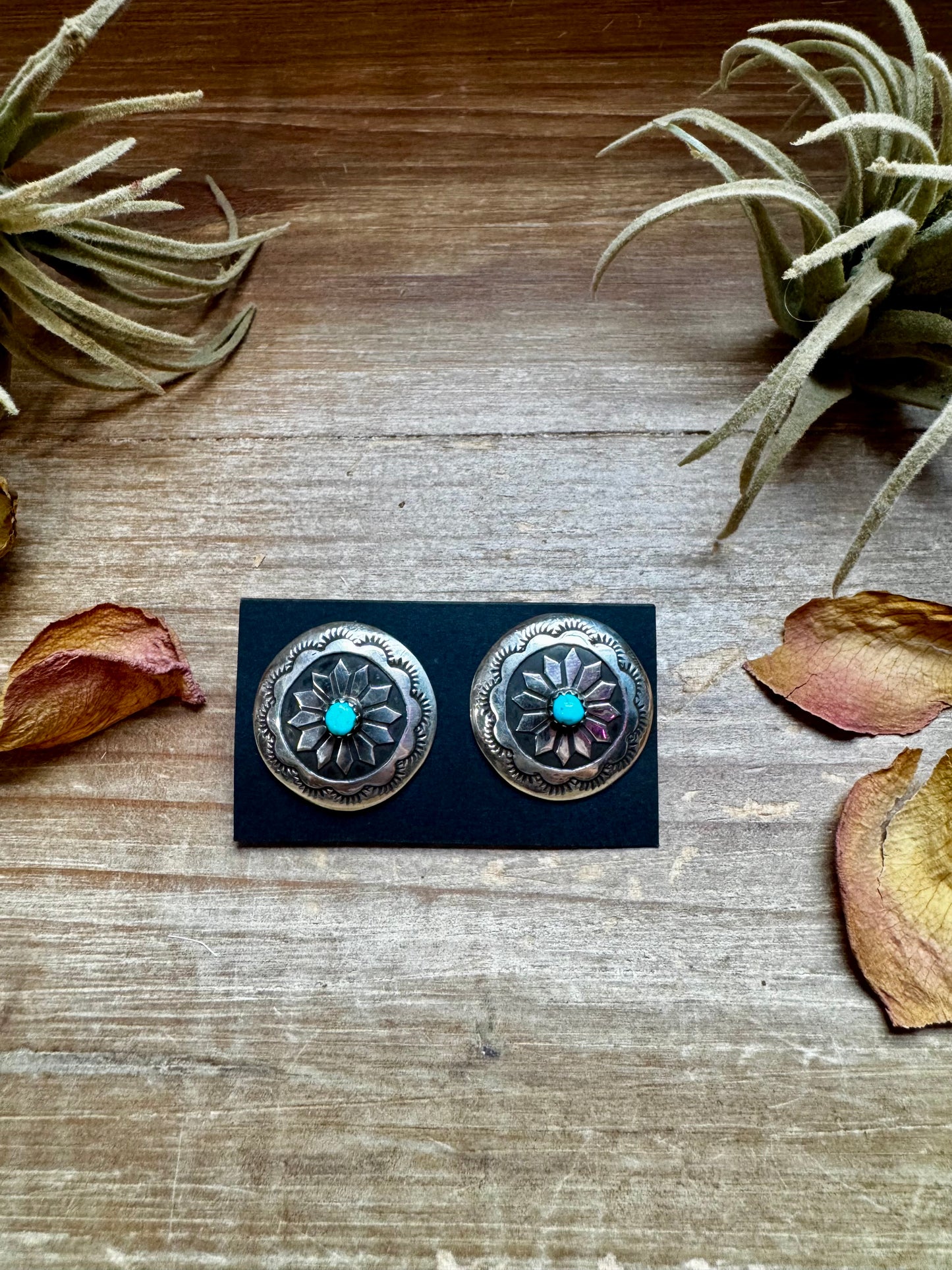 Handcrafted sterling silver concho earrings featuring genuine Kingman turquoise and unique hand-stamped details. Stamped STERLING and made in the USA. Each pair is slightly different. Curated by The Bijoux FAB.