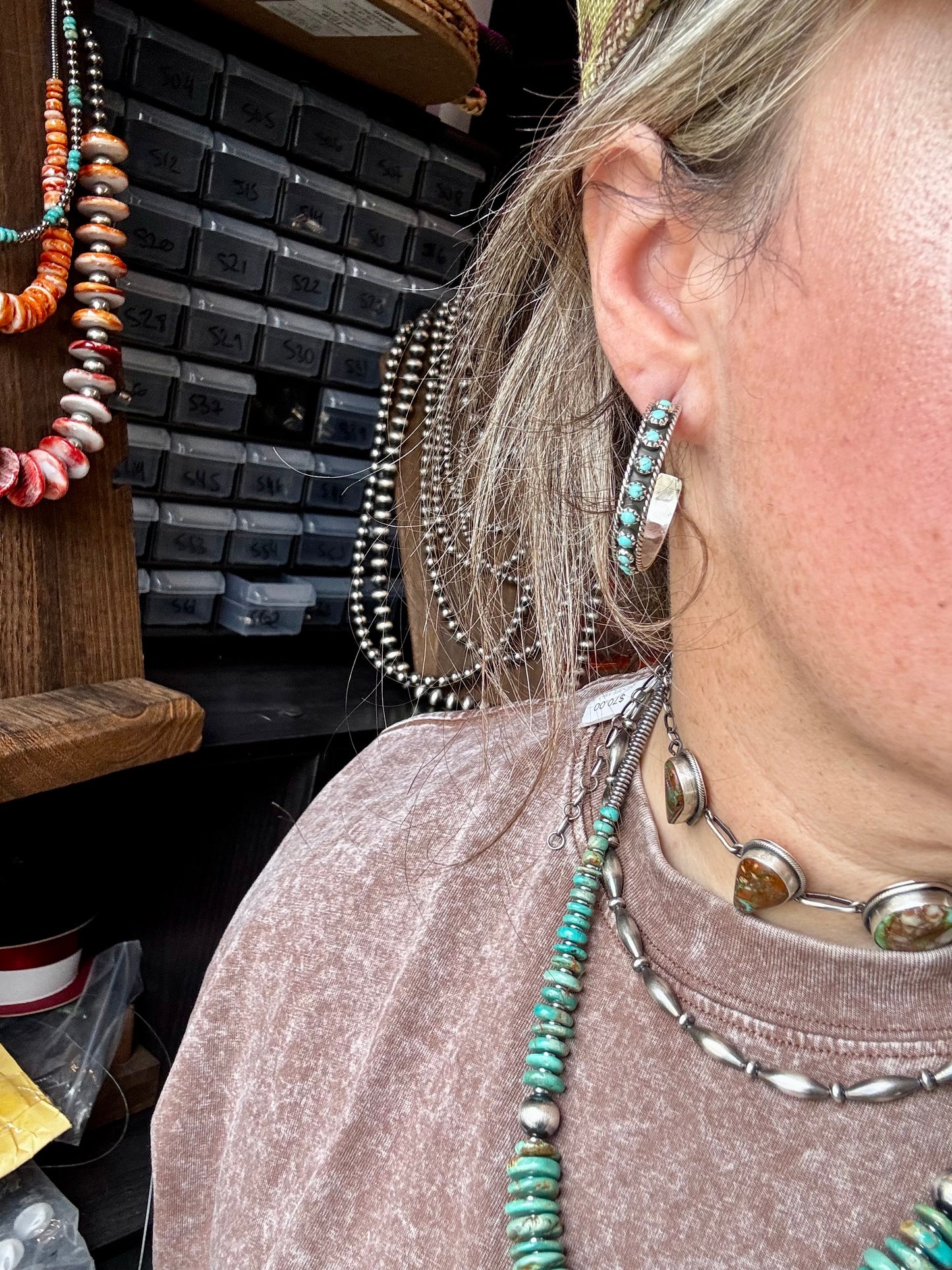 Handcrafted Snake Eye hoop earrings featuring rows of genuine Kingman turquoise stones set in solid sterling silver. Stamped FY and made in the USA. Lightweight and bold. Curated by The Bijoux FAB.