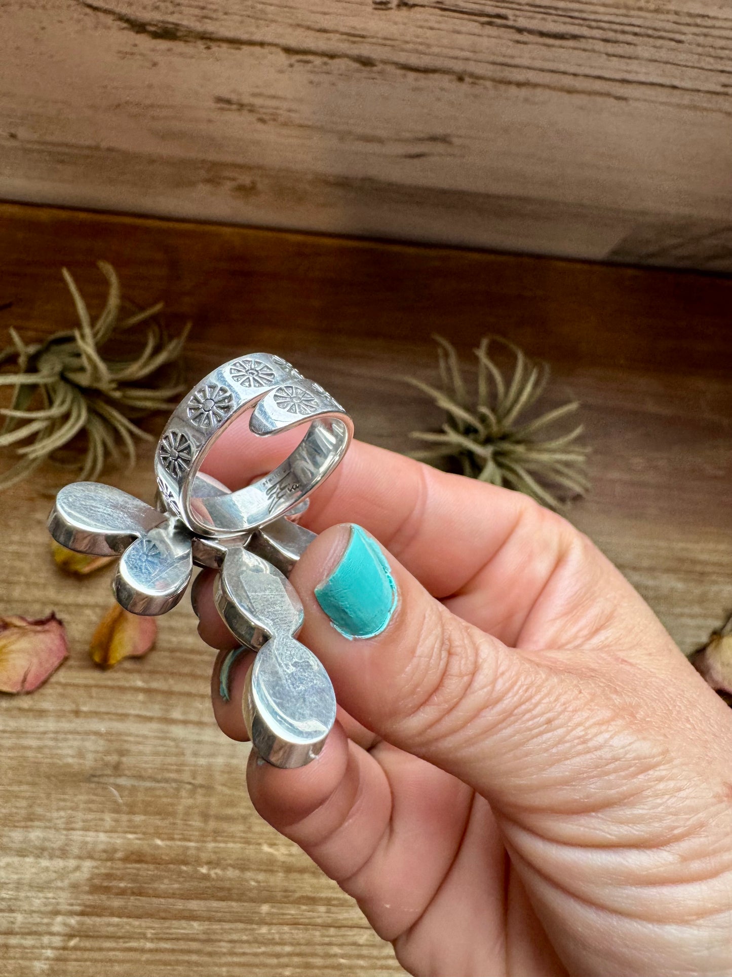 Handcrafted sterling silver dragonfly ring featuring purple and orange spiny oyster stones. Stamped ZIA and made in the USA. Adjustable fit and full of playful personality. Curated by The Bijoux FAB.