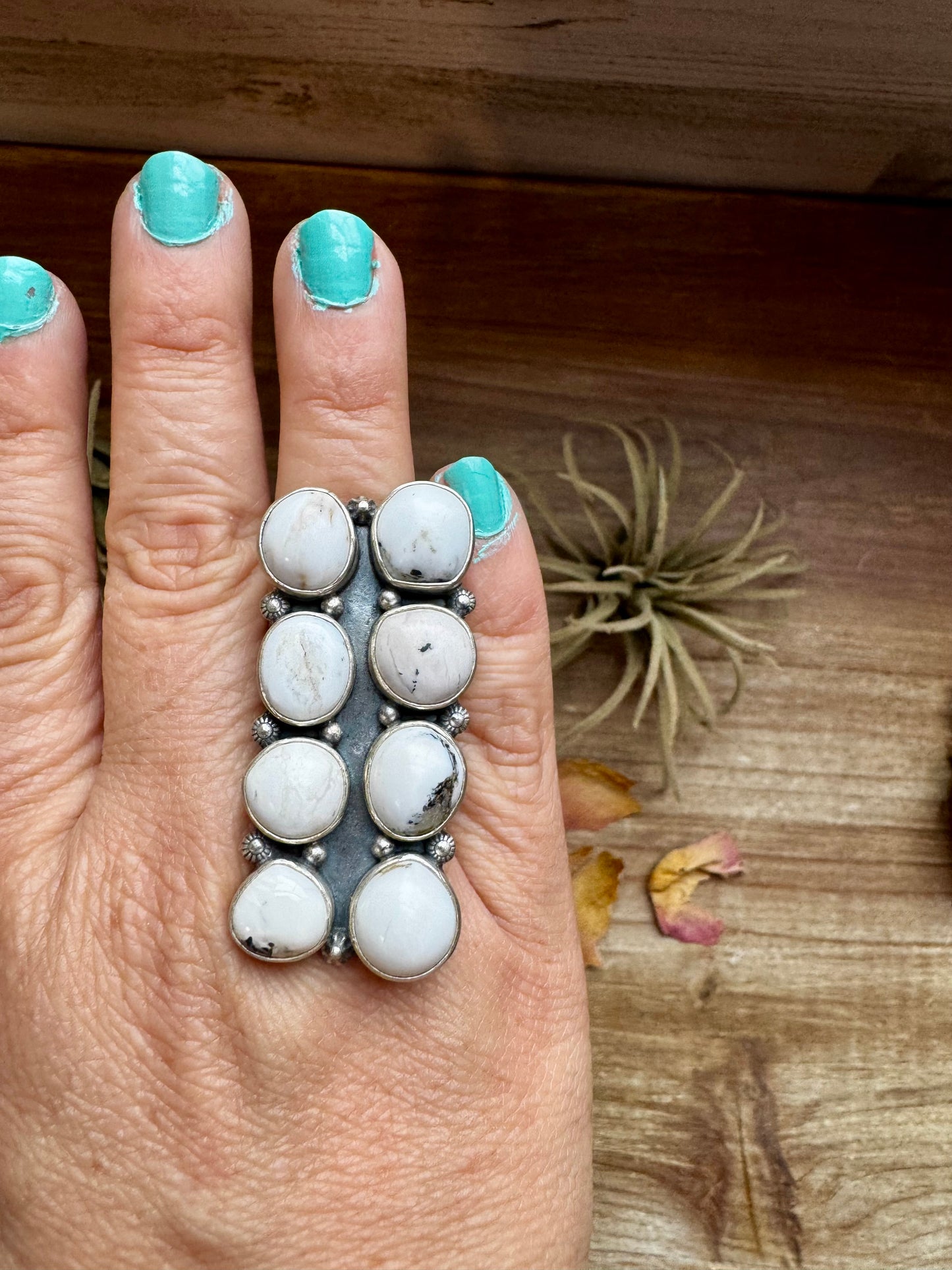 Adjustable long statement ring featuring eight genuine White Buffalo turquoise stones set in solid sterling silver with a detailed band. Stamped ZIA. Handmade in the USA. One-of-a-kind and curated by The Bijoux FAB.