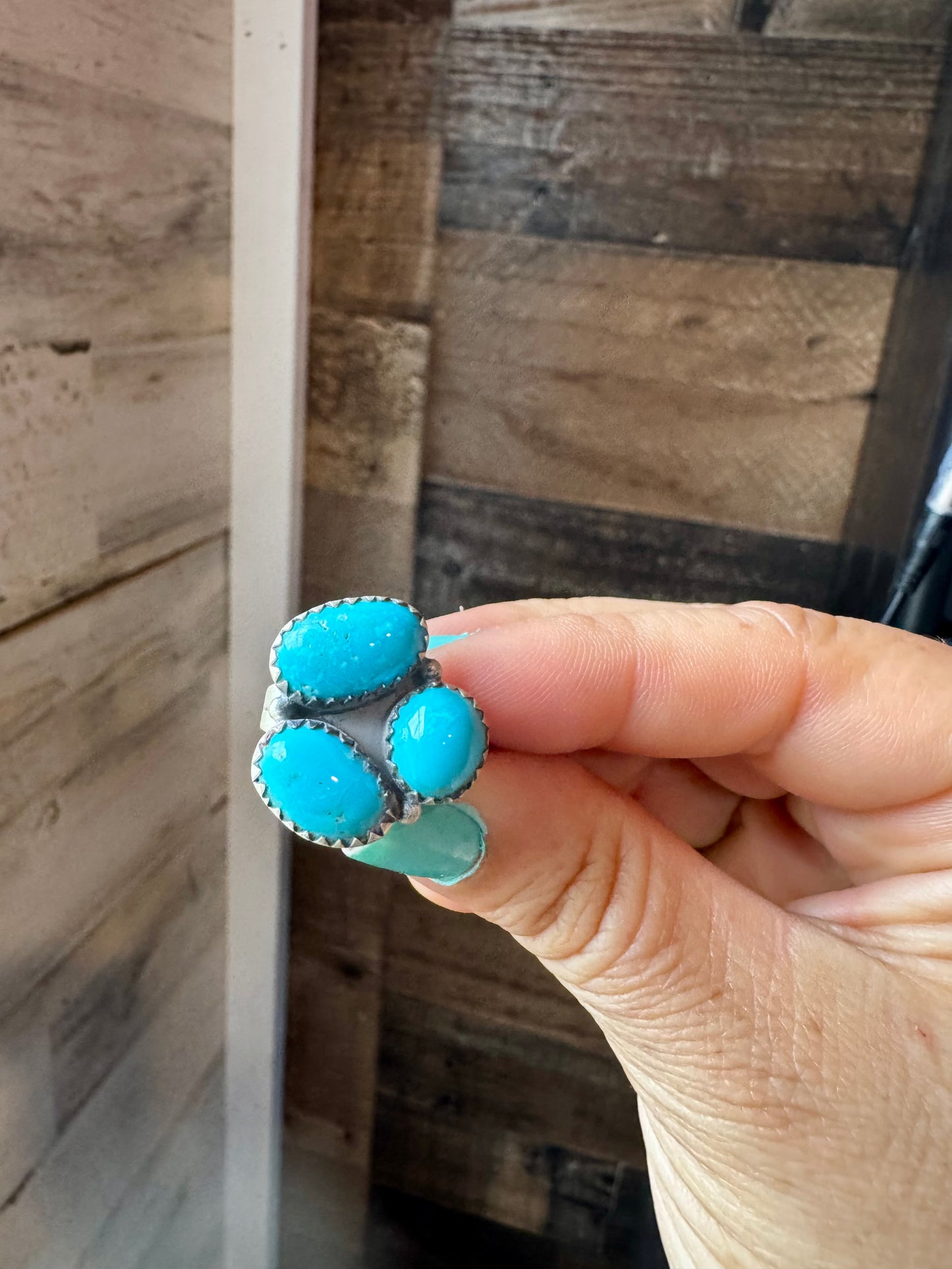 Adjustable sterling silver ring featuring three genuine Kingman turquoise stones in a bold southwestern design. Handmade in the USA. Each ring is naturally unique. Curated by The Bijoux FAB.