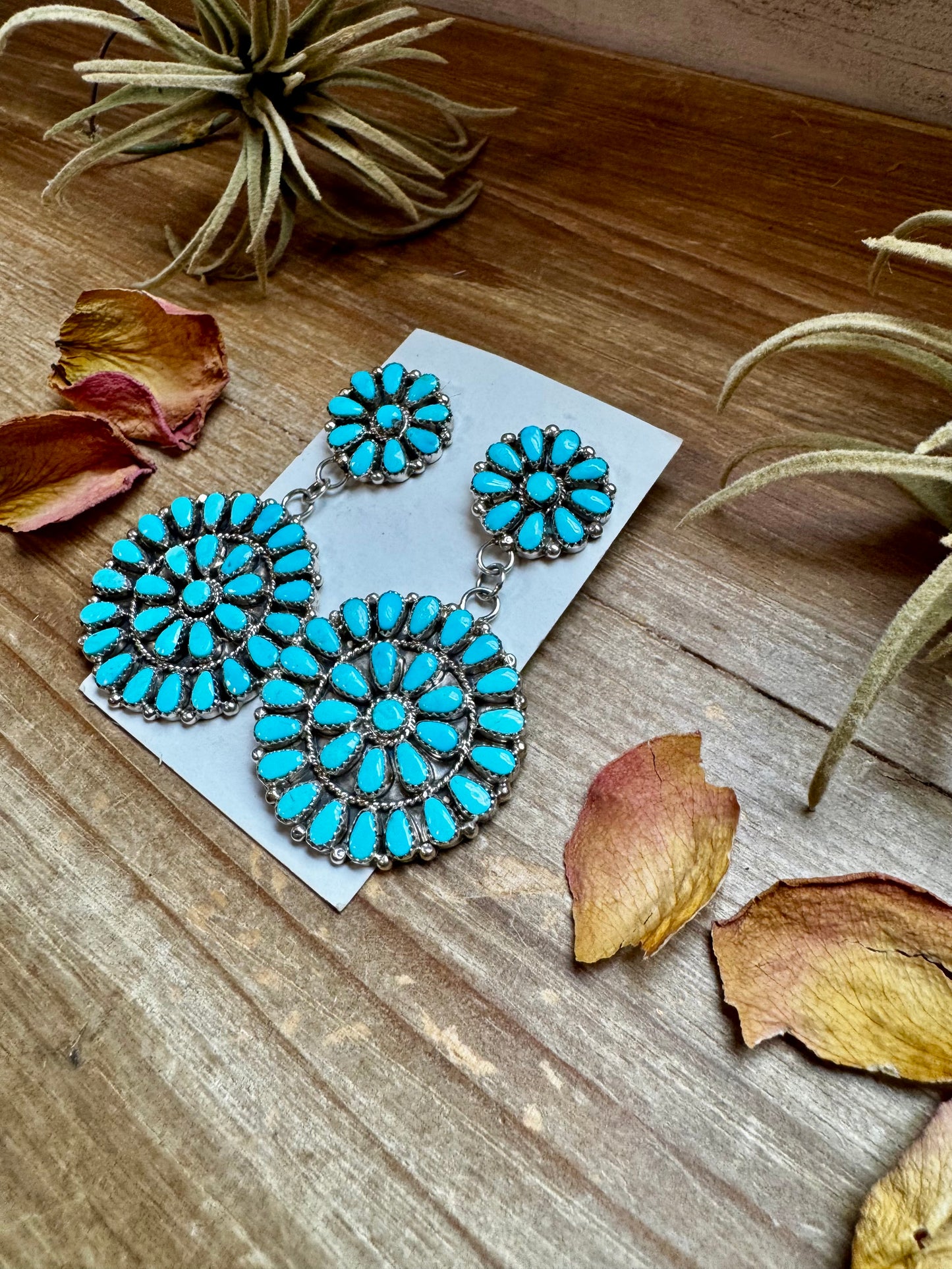 Handcrafted sterling silver cluster dangle earrings featuring genuine Sleeping Beauty turquoise stones. Post backs placed at the top for a secure drape. Artist-stamped and made in the USA. One of a kind. Curated by The Bijoux FAB.