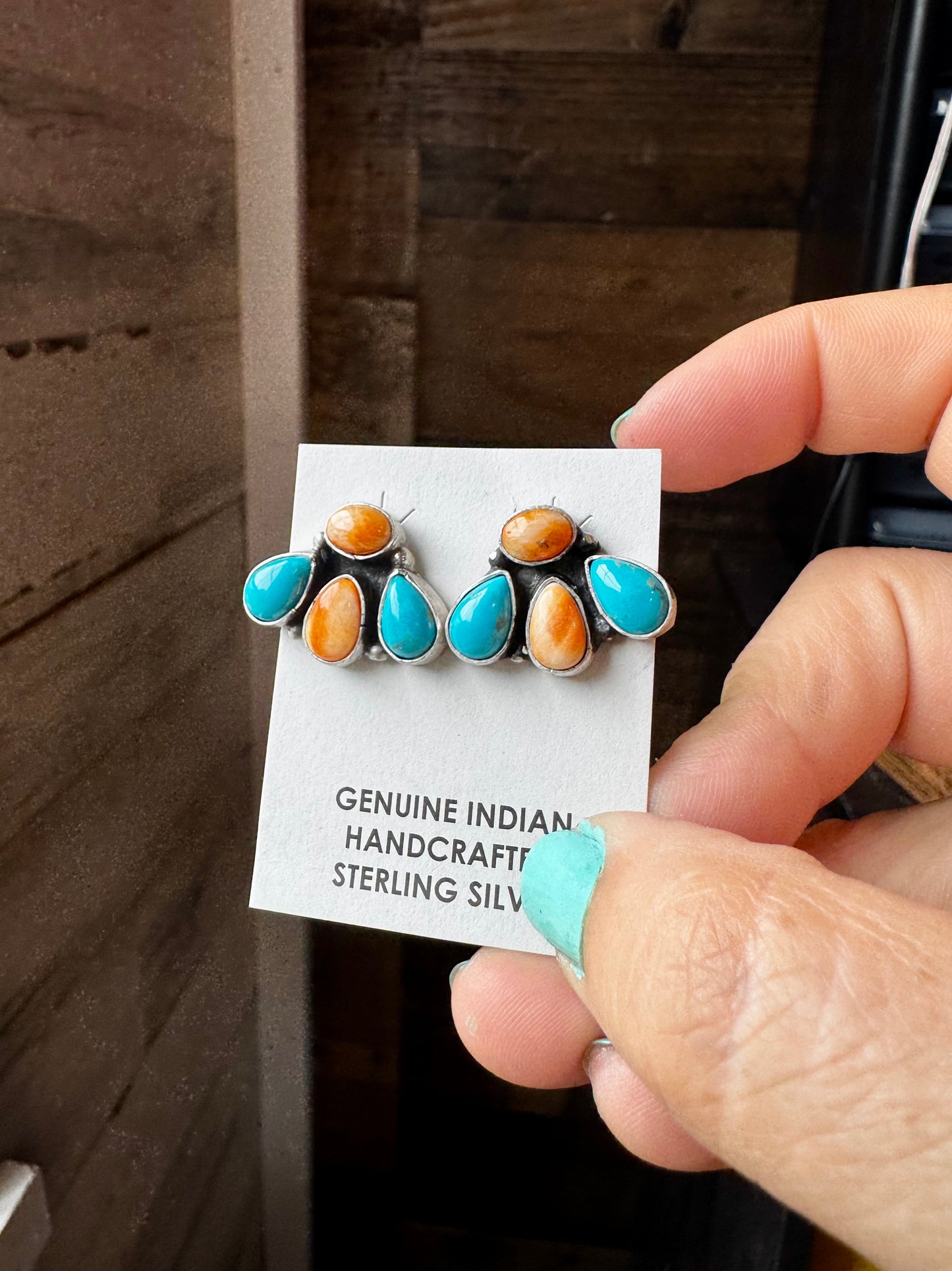 Handcrafted sterling silver stud earrings featuring orange spiny oyster and genuine turquoise stones. Stamped by Marcella James. Made in the USA. One-of-a-kind and naturally unique. Curated by The Bijoux FAB.