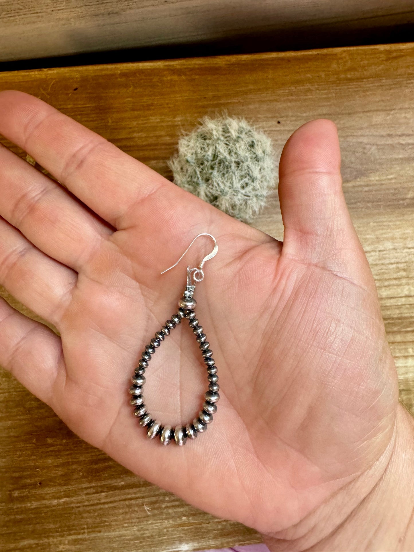 2.5-inch dangle earrings featuring 4mm, 5mm, and 6mm saucer sterling silver pearls with .925 sterling silver hooks. Handmade in the USA by The Bijoux FAB. Lightweight and easy to wear.