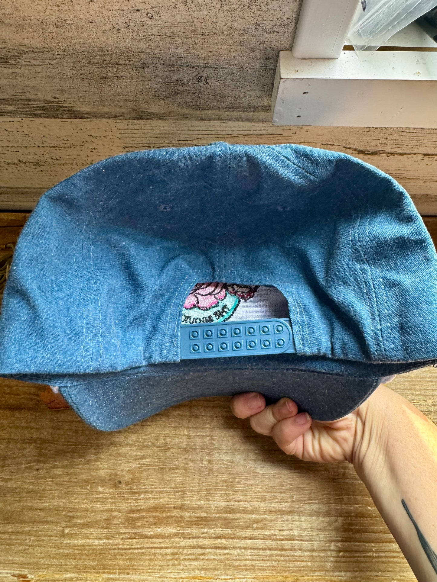 The Bijoux FAB baseball cap with embroidered logo, made in China and embroidered in Paris, Texas, adjustable fit