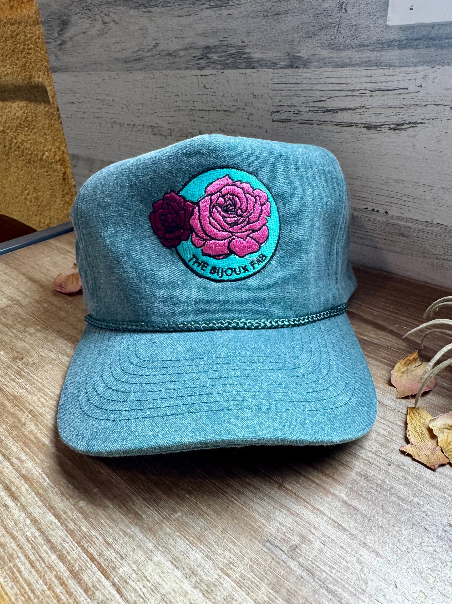 The Bijoux FAB baseball cap with embroidered logo, made in China and embroidered in Paris, Texas, adjustable fit