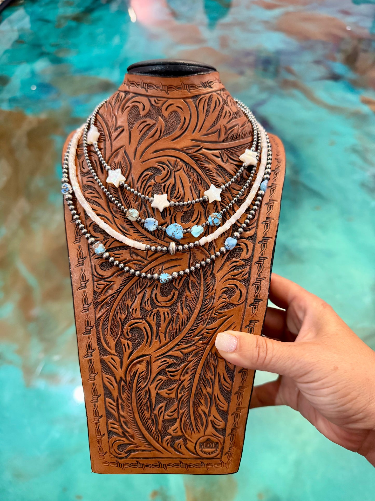 Four-piece necklace stack featuring a freshwater pearl star necklace, Golden Hill turquoise necklaces, cream shell heishi beads, and sterling silver pearls, handcrafted in the USA by The Bijoux FAB.
