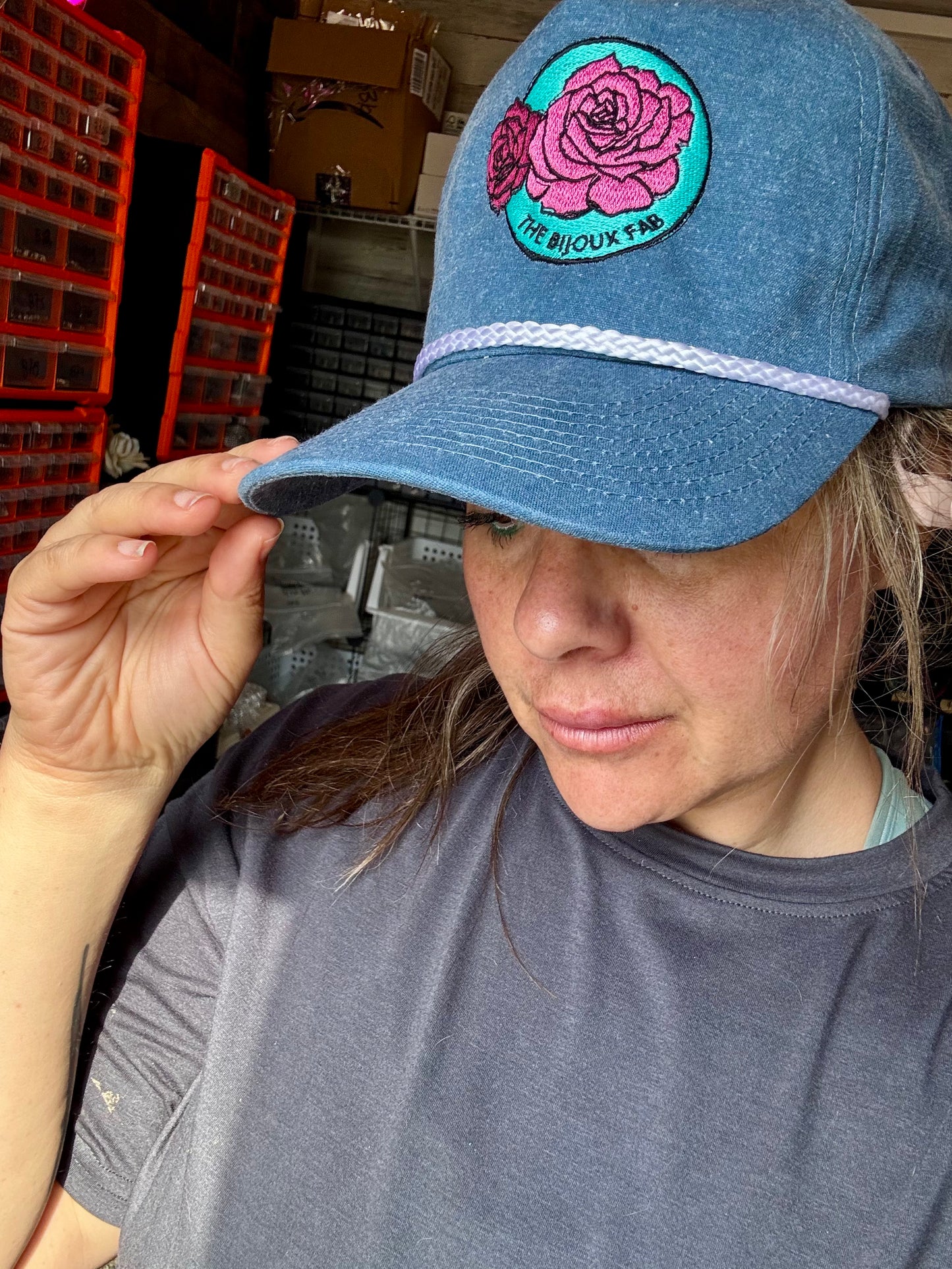 The Bijoux FAB baseball cap with embroidered logo, made in China and embroidered in Paris, Texas, adjustable fit