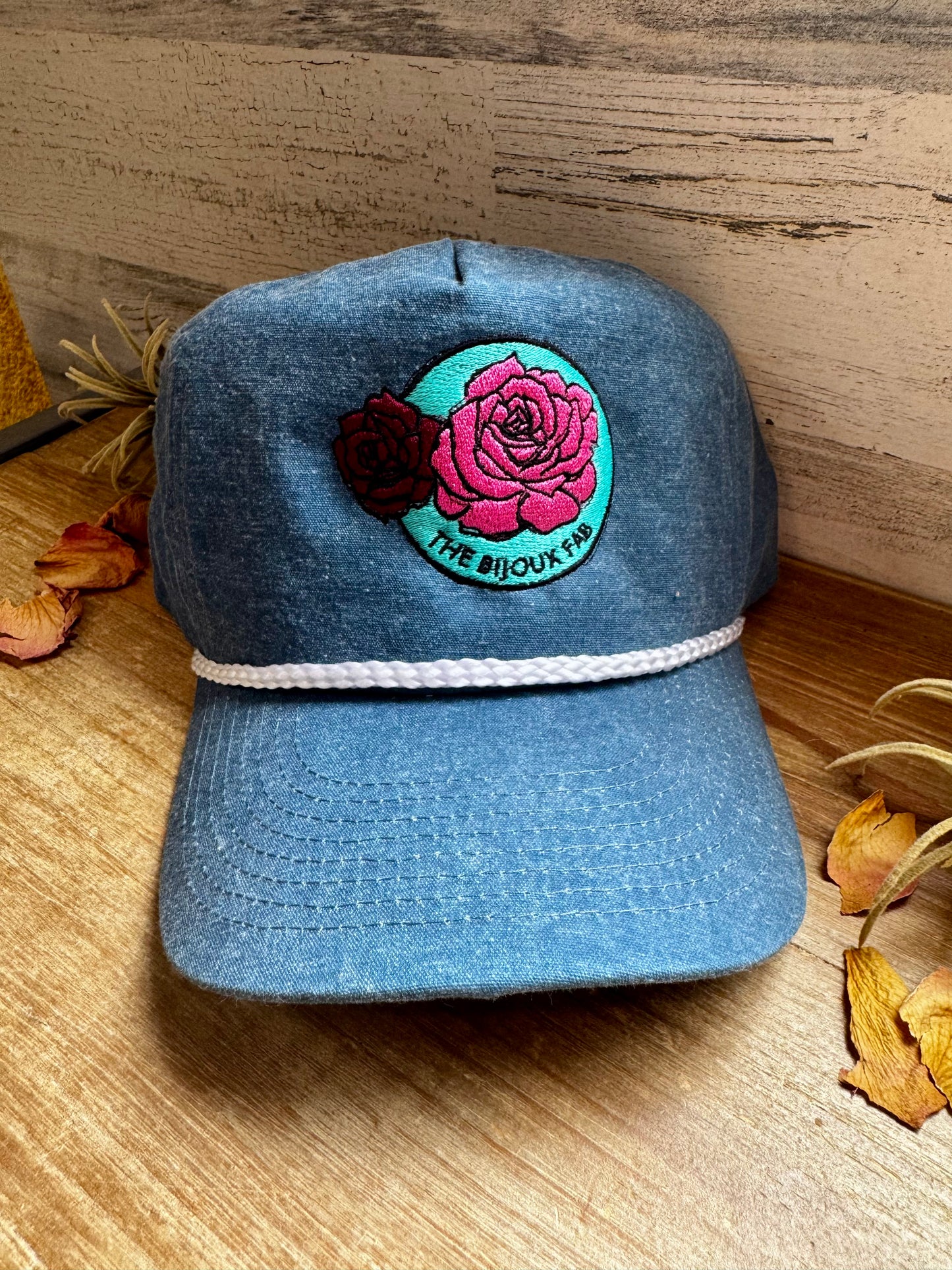 The Bijoux FAB baseball cap with embroidered logo, made in China and embroidered in Paris, Texas, adjustable fit