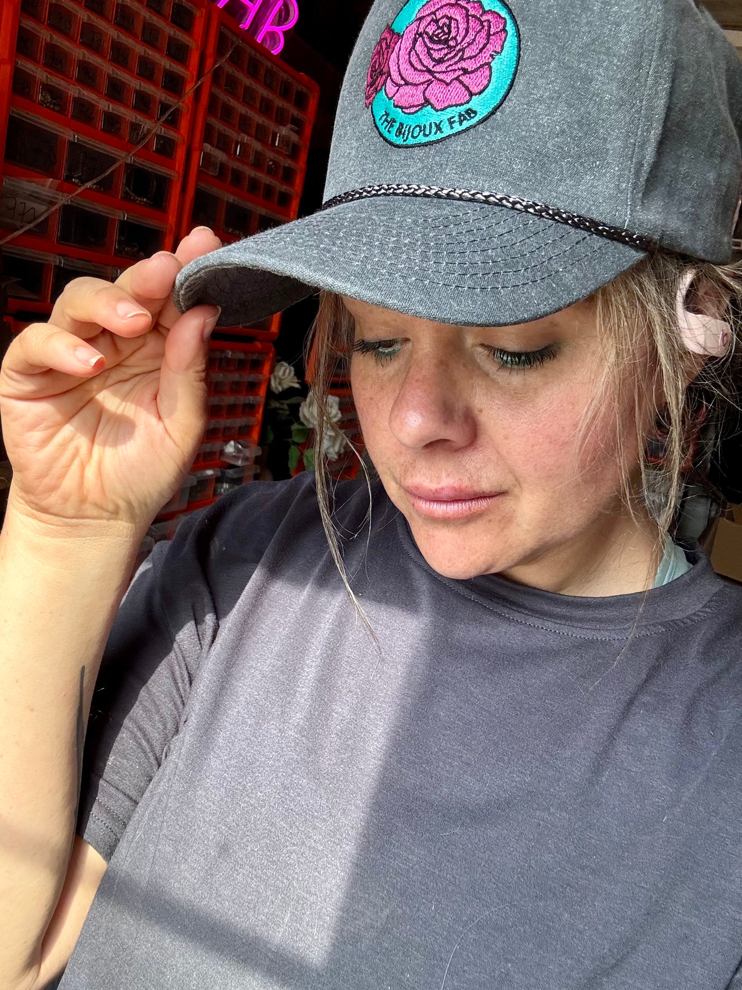 The Bijoux FAB baseball cap with embroidered logo, made in China and embroidered in Paris, Texas, adjustable fit