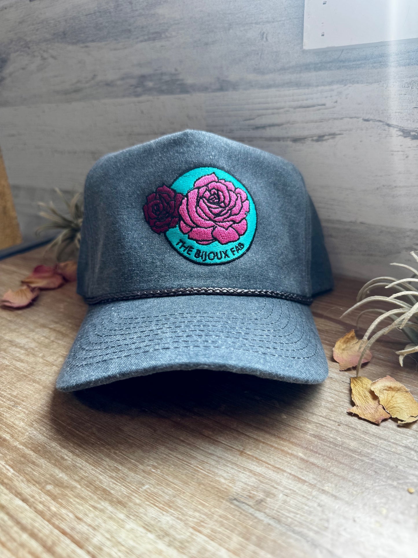 The Bijoux FAB baseball cap with embroidered logo, made in China and embroidered in Paris, Texas, adjustable fit
