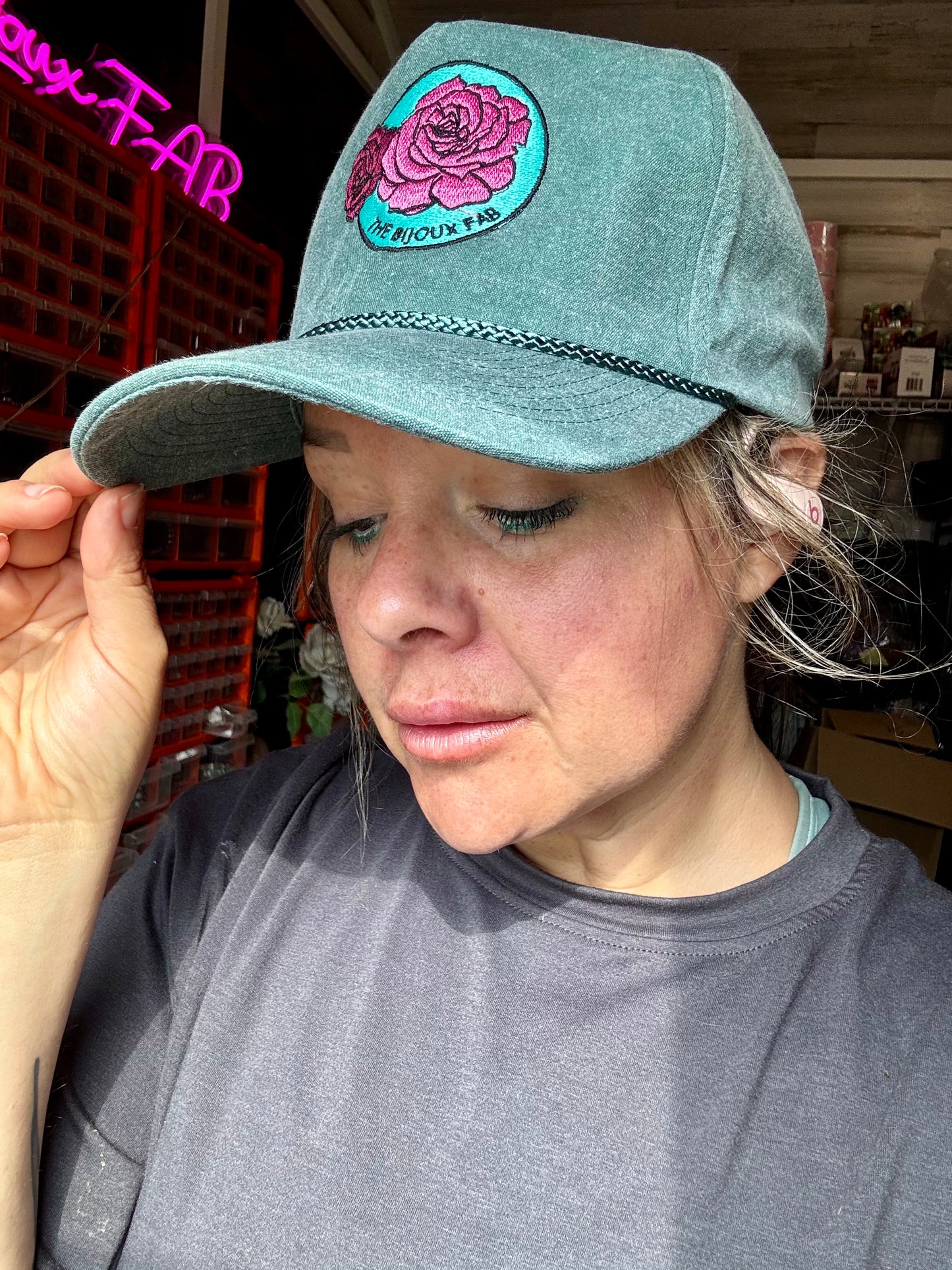 The Bijoux FAB baseball cap with embroidered logo, made in China and embroidered in Paris, Texas, adjustable fit
